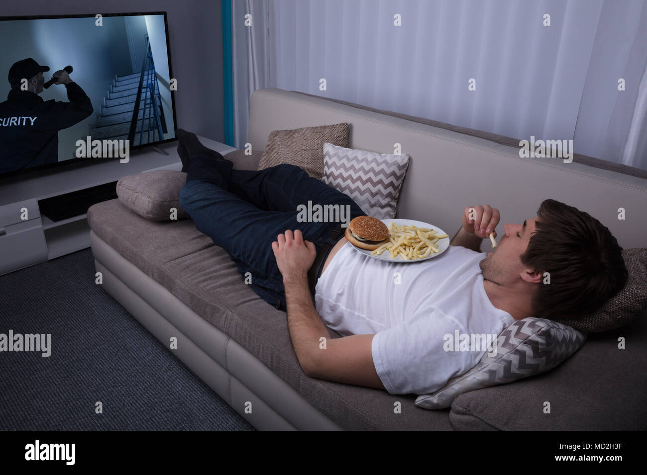 Man Burger Sofa High Resolution Stock Photography and Images - Alamy