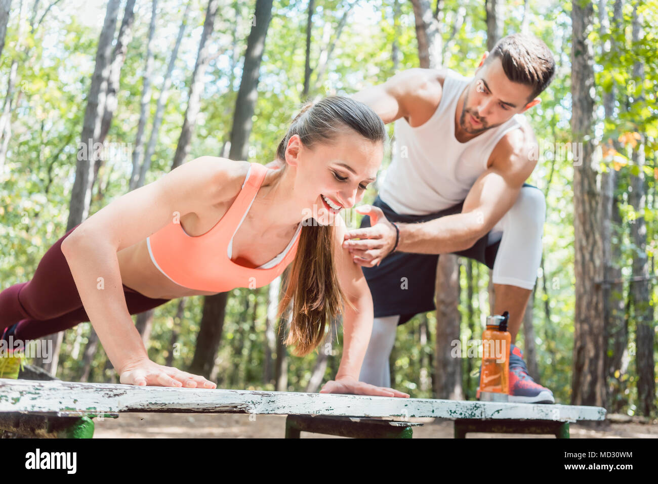 Woman doing push ups in the park hi-res stock photography and images ...