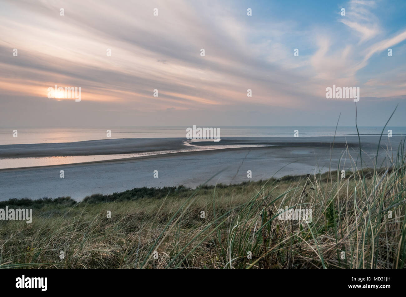 The beach at the Maasvlakte near the Port of Rotterdam in the Netherlands during sunset. Stock Photo