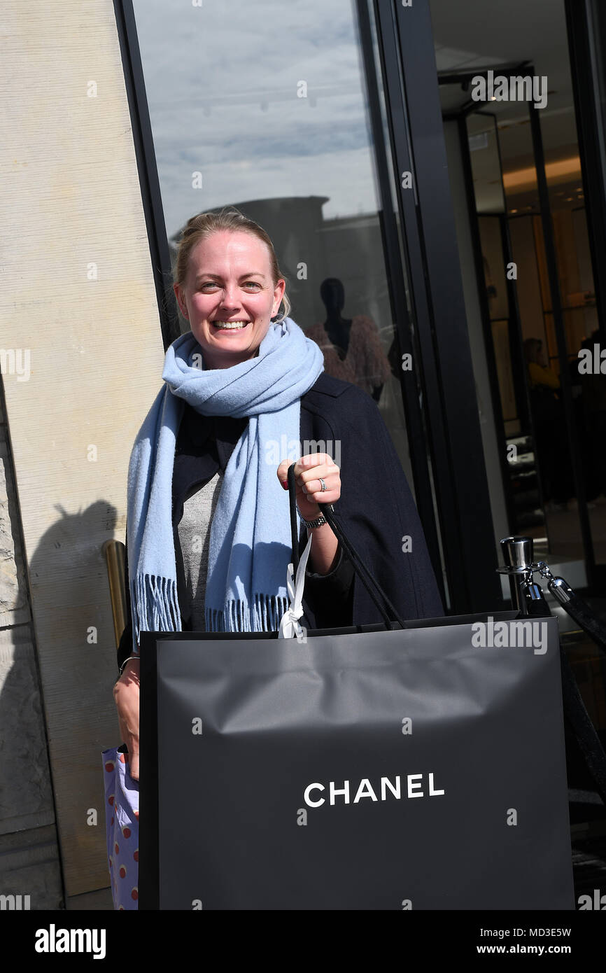 Copenhagen, Denmark. 18th Apr, 2018. French chain Chanel opens its first shop ever in Copenhagen first consumer with Chanel shopping bag and consumer waiting outside in line at chanel shop to shopping today on its first day of Chanel business in Copenhagen Denmaerk..       (Photo.Francis Joseph  Dean / Deanpictures. Credit: Francis Joseph Dean / Deanpictures/Alamy Live News Stock Photo