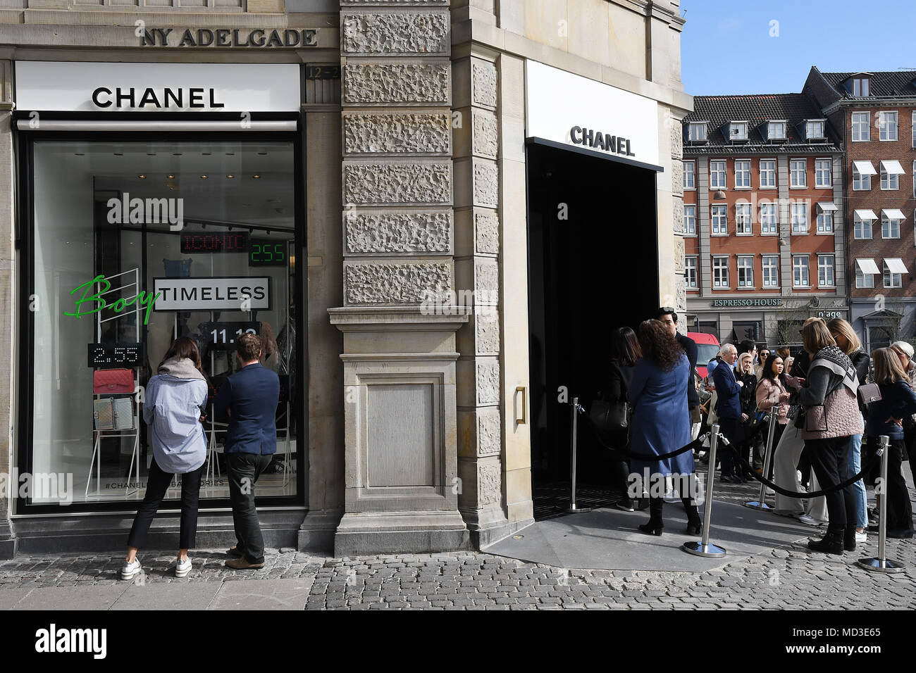 Copenhagen, Denmark. 18th Apr, 2018. French chain Chanel opens its first shop ever in Copenhagen first consumer with Chanel shopping bag and consumer waiting outside in line at chanel shop to shopping today on its first day of Chanel business in Copenhagen Denmaerk..       (Photo.Francis Joseph  Dean / Deanpictures. Credit: Francis Joseph Dean / Deanpictures/Alamy Live News Stock Photo