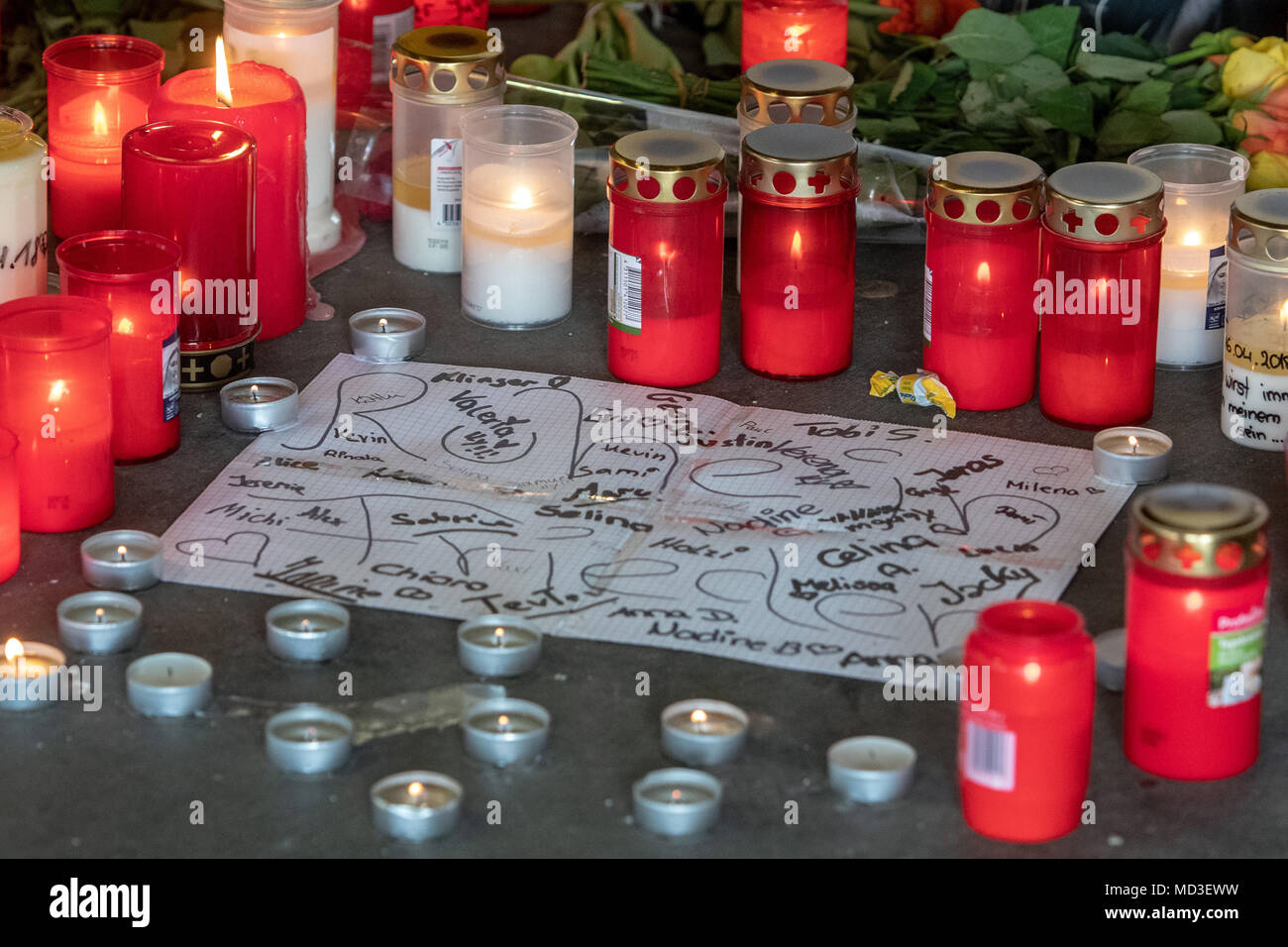 18 April 2018, Passau, Germany: Candles and flowers lying in front of an underground pedestrian passageway. According to an autopsy report by the police on Wednesday, the boy suffocated on his own blood during the fight an underground pedestrian passageway. Photo: Armin Weigel/dpa Stock Photo