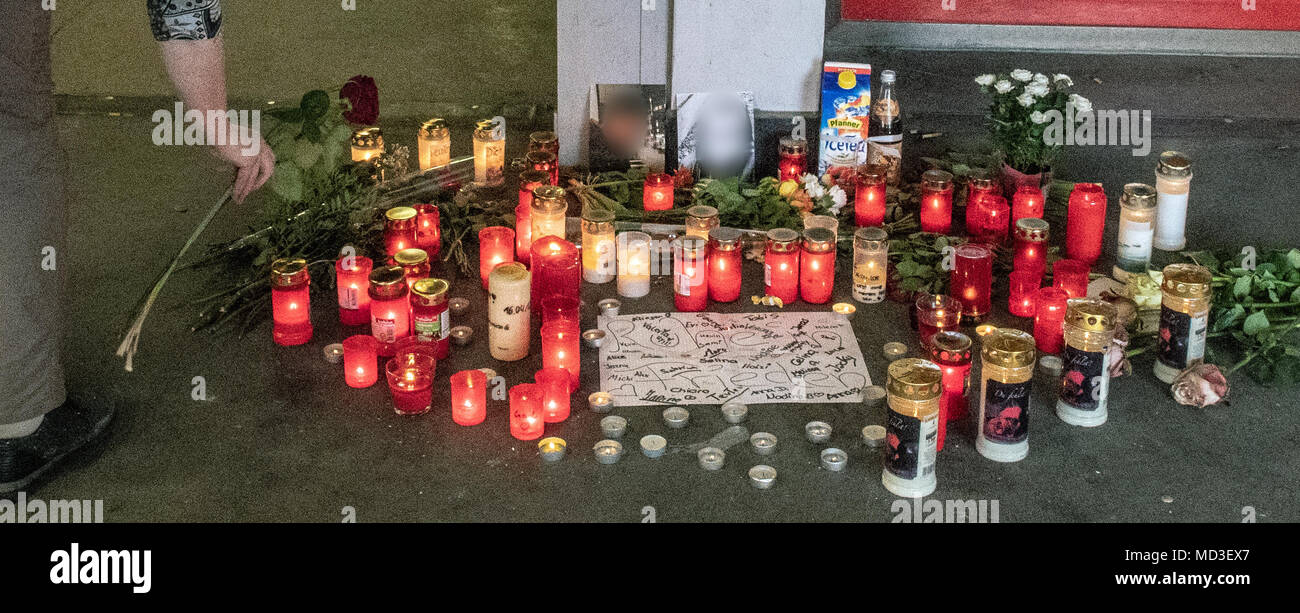 18 April 2018, Passau, Germany: A woman places a rose at the crime scene. According to an autopsy report by the police on Wednesday, the boy suffocated on his own blood during the fight an underground pedestrian passageway. Photo: Armin Weigel/dpa Stock Photo