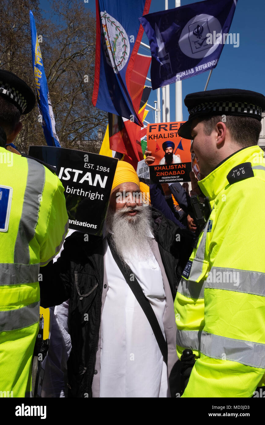 London, UK. 18th April 2018. London Protests: Hundreds of very loud protestors gathered in London's Parliament Square, outside the Houses of Parliament to greet the Indian Prime Minister Narendra Modi who is in London for the Commonwealth Heads of Government Meeting.  They are protes Credit: Tim Ring/Alamy Live News Stock Photo