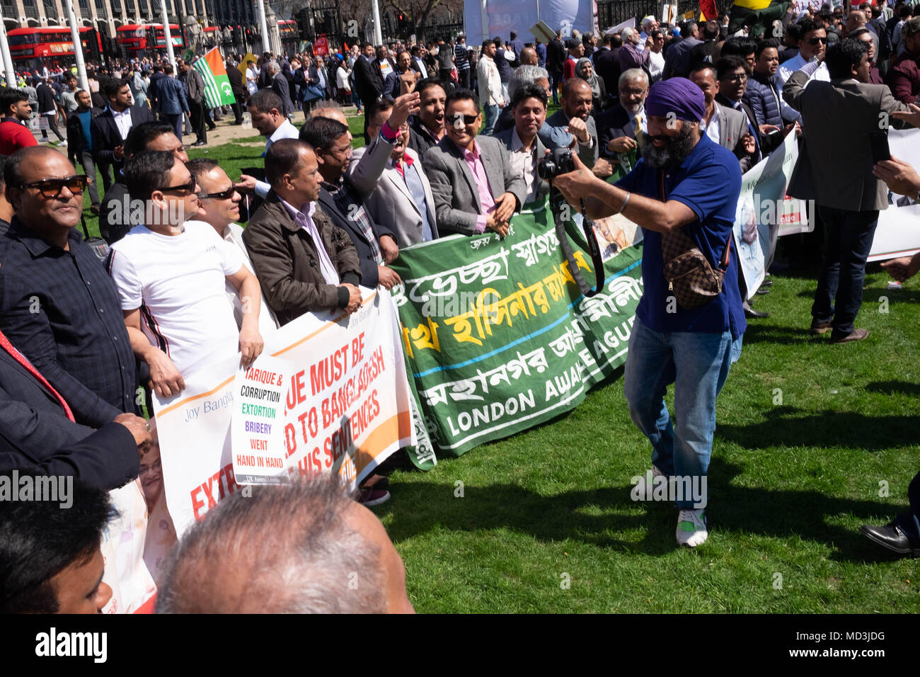 London, UK. 18th April 2018. London Protests: Hundreds of very loud protestors gathered in London's Parliament Square, outside the Houses of Parliament to greet the Indian Prime Minister Narendra Modi who is in London for the Commonwealth Heads of Government Meeting.  They are protes Credit: Tim Ring/Alamy Live News Stock Photo