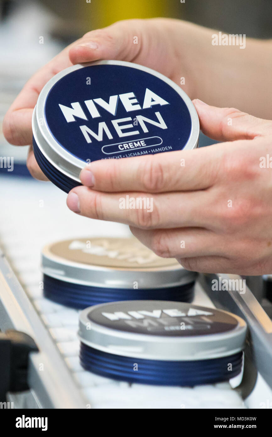 18 April 2018, Germany, Hamburg: An employee checks a Nivea-Creme of 