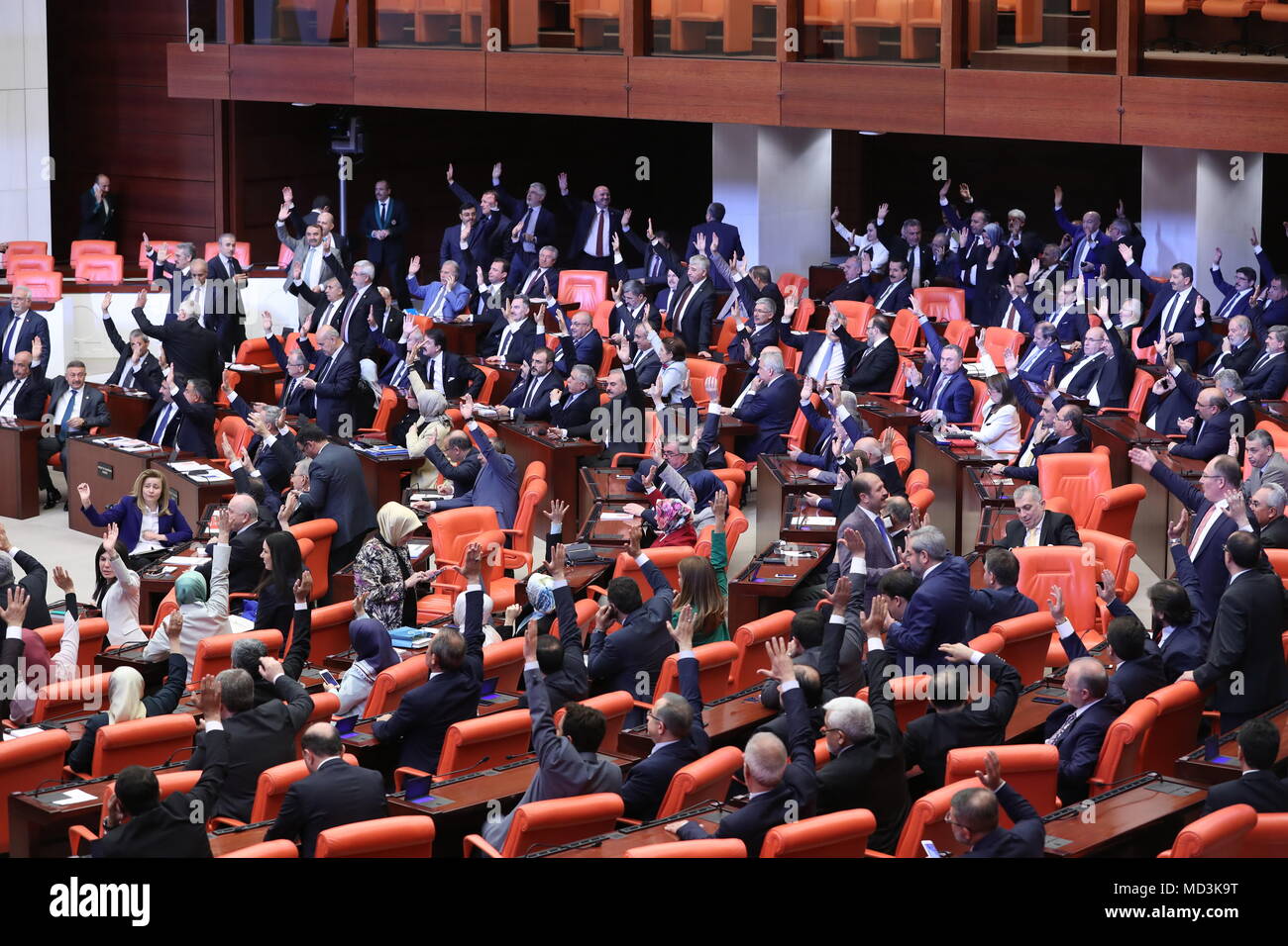 Ankara. 18th Apr, 2018. Lawmakers vote on extending the ongoing state of emergency at Turkish parliament in Ankara, Turkey, on April 18, 2018. Turkish parliament on Wednesday approved a motion to extend the ongoing state of emergency for three more months. Credit: Xinhua/Alamy Live News Stock Photo