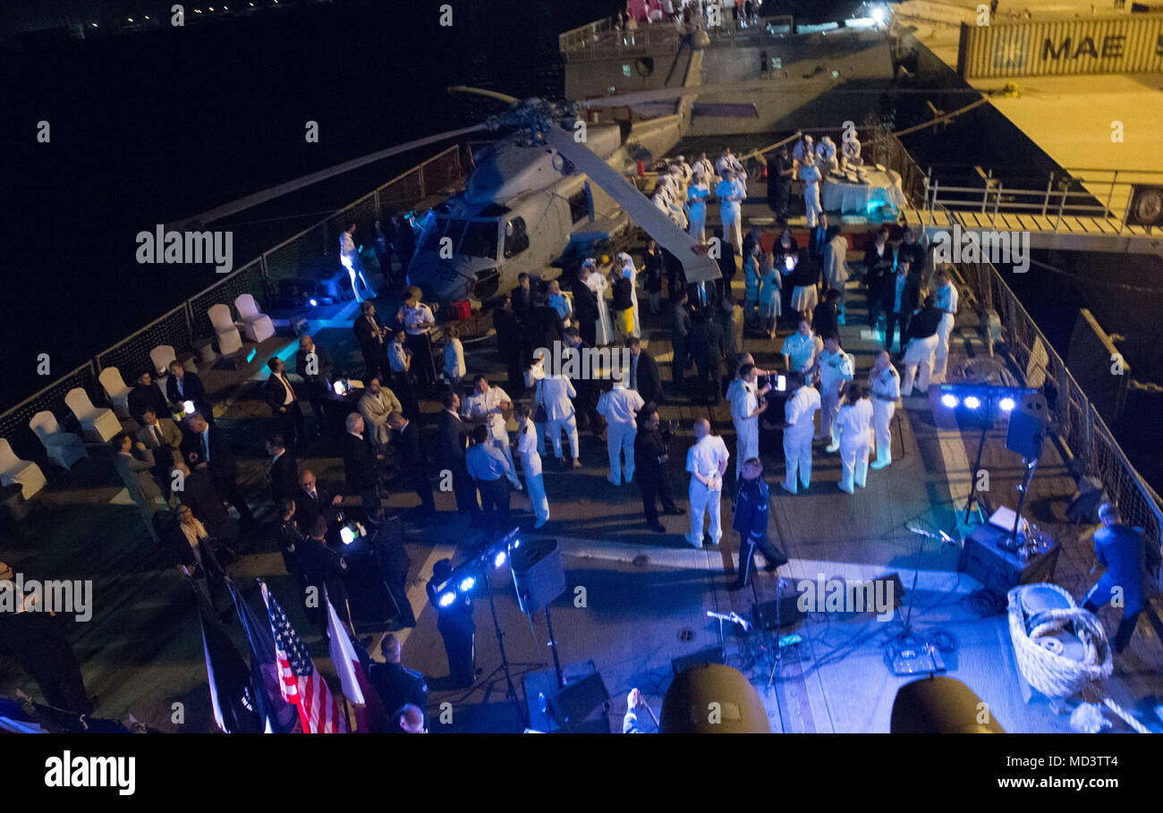 180314-N-OI558-2509 DOHA, Qatar (Mar. 11, 2018) the Arleigh Burke-class guided-missile destroyer USS Sampson (DDG 102) hosts a reception aboard their flight deck during the Doha International Maritime Defense Exhibition and Conference (DIMDEX). Sampson is deployed with the Theodore Roosevelt Carrier Strike Group to the U.S. 5th Fleet area of operations in support of maritime operations to reassure allies and partners and preserve the freedom of navigation and the free flow of commerce in the region. (U.S. Navy photo by Mass Communication Specialist 3rd Class Chanel L. Turner/Released) Stock Photo