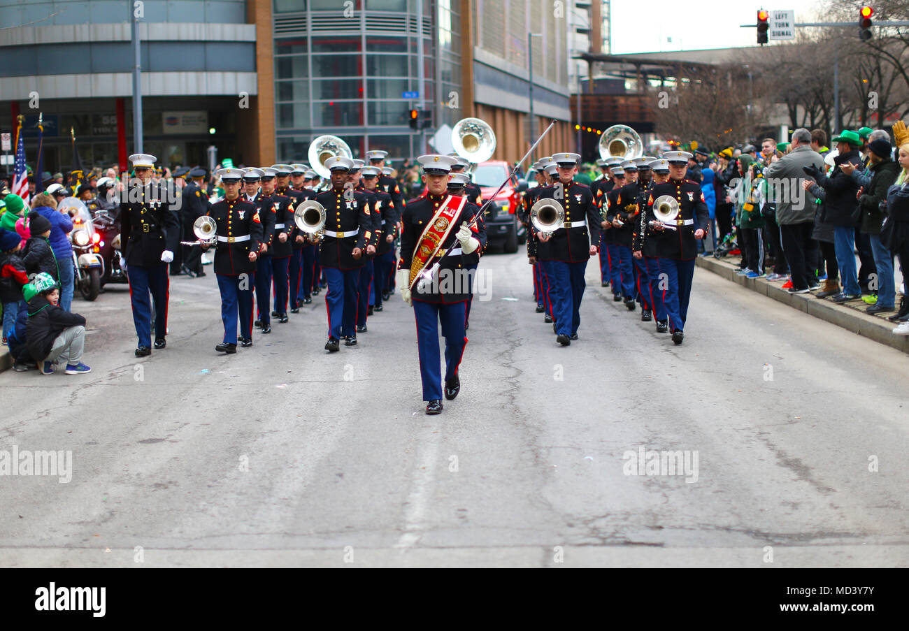 Marines with the 3rd Marine Aircraft Wing band perform during the Pittsburgh St. Patrick’s Day Parade, March 17. The 3rd MAW band’s presence at high-visibility events allows positive interaction with the public and assists in recruiting efforts across the country. (U.S. Marine Corps photo by Sgt. David Bickel/Released) Stock Photo