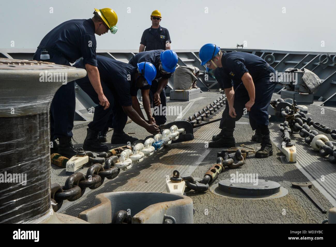 ARABIAN GULF (March 16, 2018) Sailors attach a pelican hook to the anchor  chain during a precision anchorage evolution aboard the guided-missile  cruiser USS Bunker Hill (CG 52). Bunker Hill is deployed