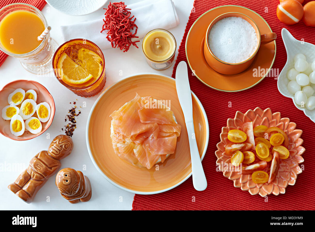 Table with fresh salmon, boiled eggs and tomatoes Stock Photo
