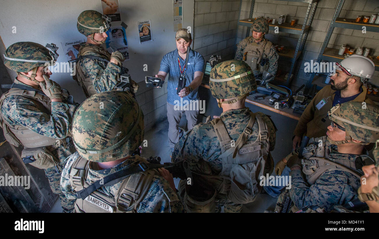 U.S. Marines with 3rd Battalion, 4th Marine Regiment, 1st Marine Division listen to a brief about a communication system during Urban Advanced Naval Technology Exercise 2018 (ANTX18) at Marine Corps Base Camp Pendleton, California, March 15, 2019. The Marines are testing next generation technologies to provide the opportunity to assess the operational utility of emerging technologies and engineering innovations that improve the Marine’s survivability, lethality and connectivity in complex urban environments. (U.S. Marine Corps photo by Lance Cpl. Rhita Daniel) Stock Photo