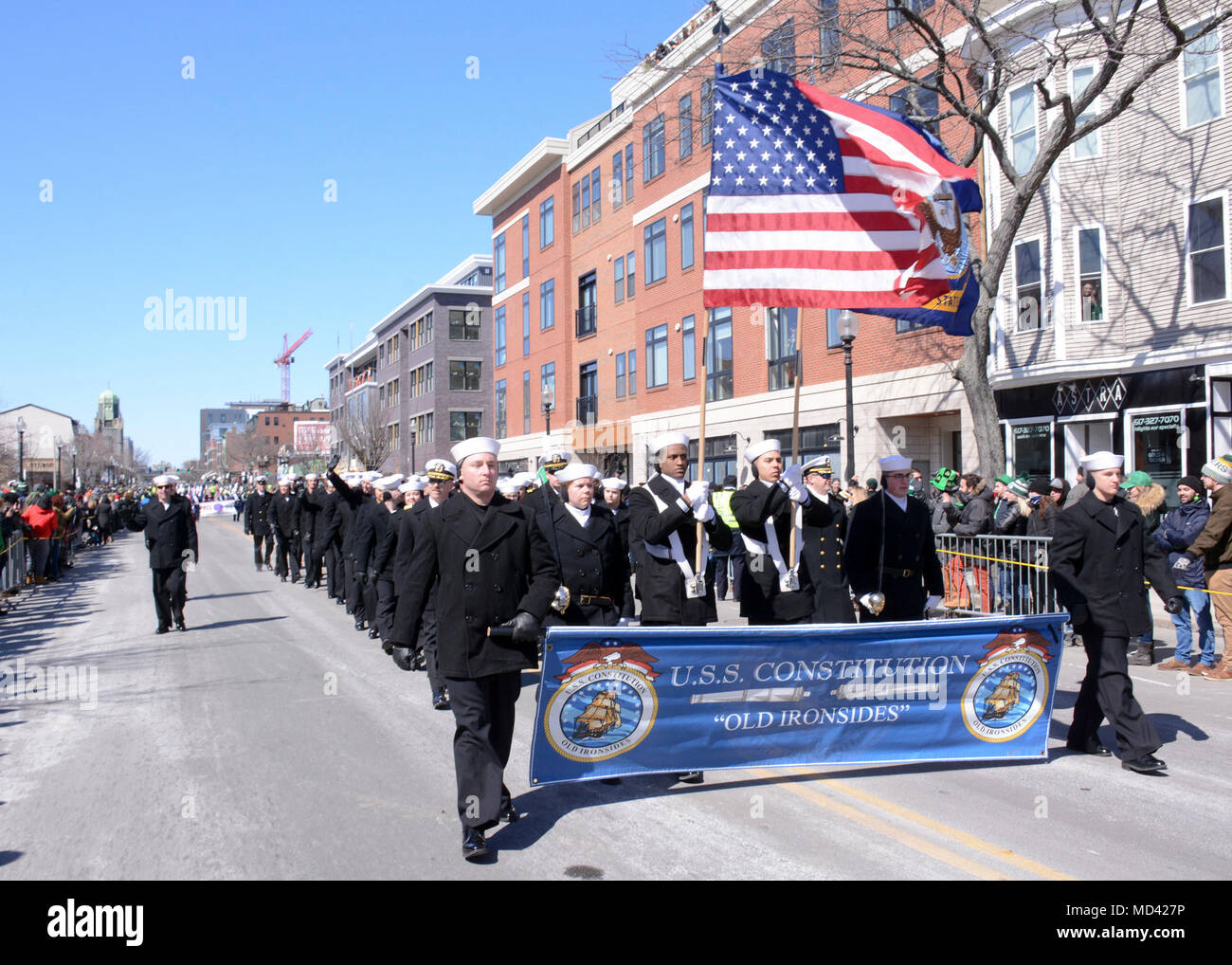 180318-N-SM577-0105 BOSTON (March 18, 2018) Sailors assigned to USS Constitution march through the streets of Boston during its annual Evacuation Day Parade. The parade commemorates the day that British troops evacuated Boston during the American Revolutionary War, which took place on March 17, 1776. (U.S. Navy photo by Mass Communication Specialist 3rd Class Casey Scoular/Released) Stock Photo
