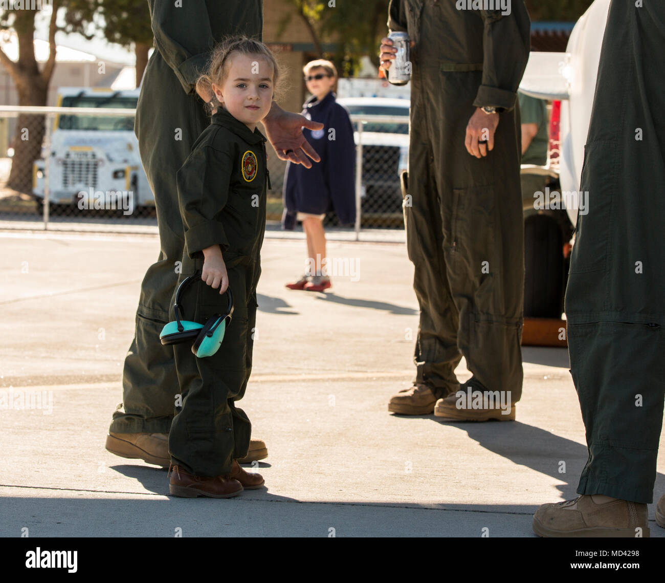 Guests observe the static dispalys at the 2018 Yuma Airshow hosted by Marine Corps Air Station Yuma, Ariz., Saturday, March 17, 2018. The airshow is MCAS Yuma's only military airshow of the year and provides the community an opportunity to see thrilling aerial and ground performers for free while interacting with Marines and Sailors. (U.S. Marine Corps photo by Lance Cpl. Sabrina Candiaflores) Stock Photo