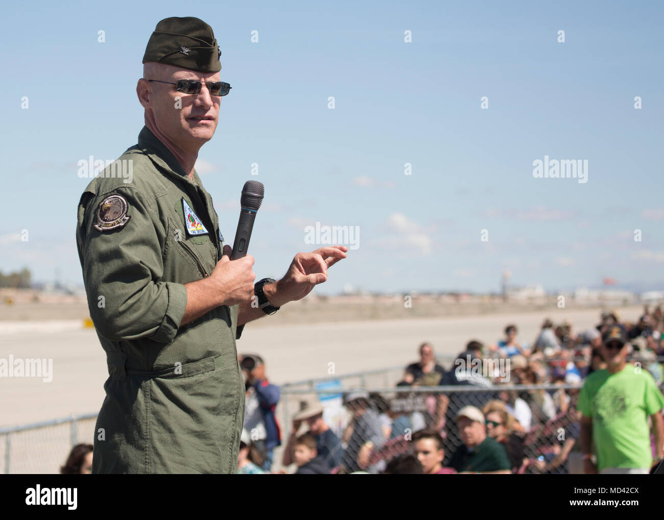 U.S. Marine Corps Col. David A. Suggs, the commanding officer of Marine Corps Air Station Yuma, Ariz., speaks to guests at the 2018 Yuma Airshow Saturday, March 17, 2018. The airshow is MCAS Yuma's only military airshow of the year and provides the community an opportunity to see thrilling aerial and ground performers for free while interacting with Marines and Sailors. (U.S. Marine Corps photo by Lance Cpl. Sabrina Candiaflores) Stock Photo