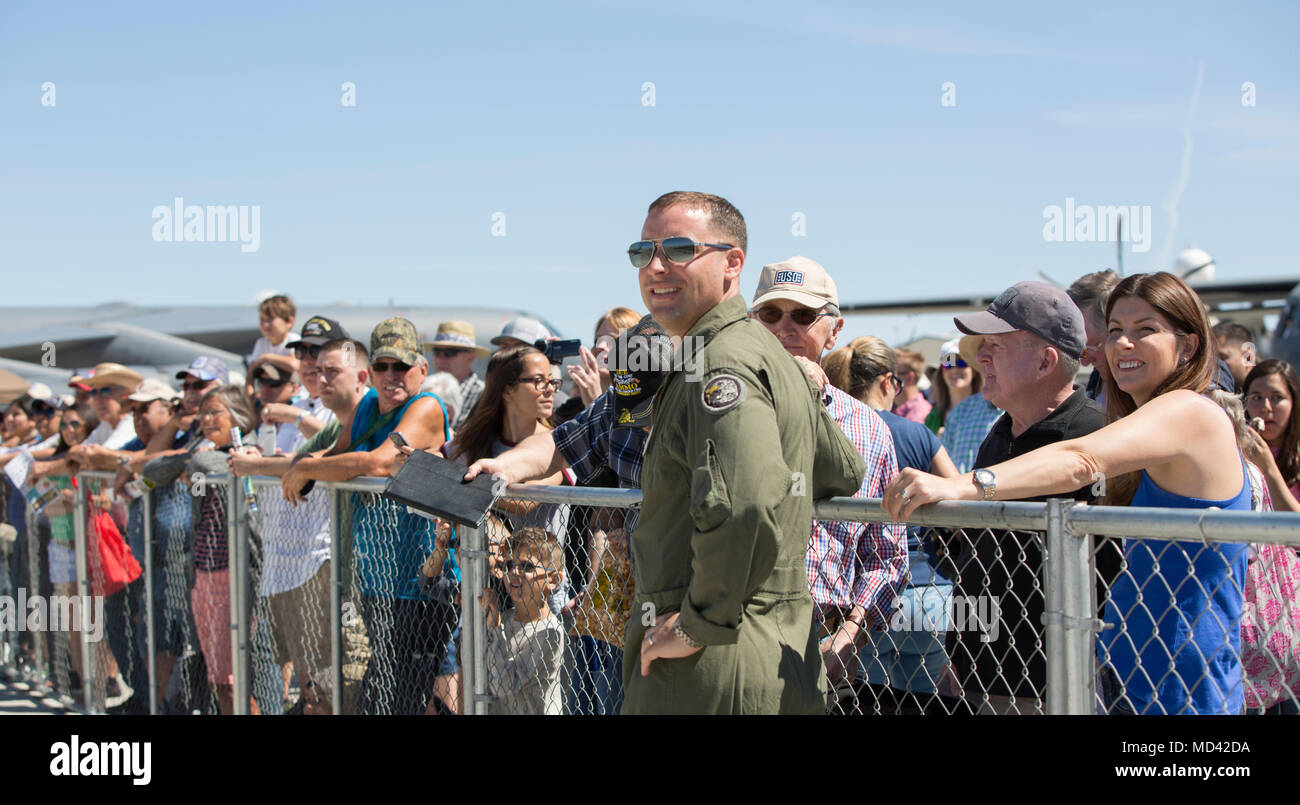 Spectators watch as the Marine Corps' F-35B 'Lightning II' performs an aerial routine at the 2018 Yuma Airshow hosted by Marine Corps Air Station Yuma, Ariz., Saturday, March 17, 2018. The airshow is MCAS Yuma's only military airshow of the year and provides the community an opportunity to see thrilling aerial and ground performers for free while interacting with Marines and Sailors. (U.S. Marine Corps photo by Lance Cpl. Sabrina Candiaflores) Stock Photo