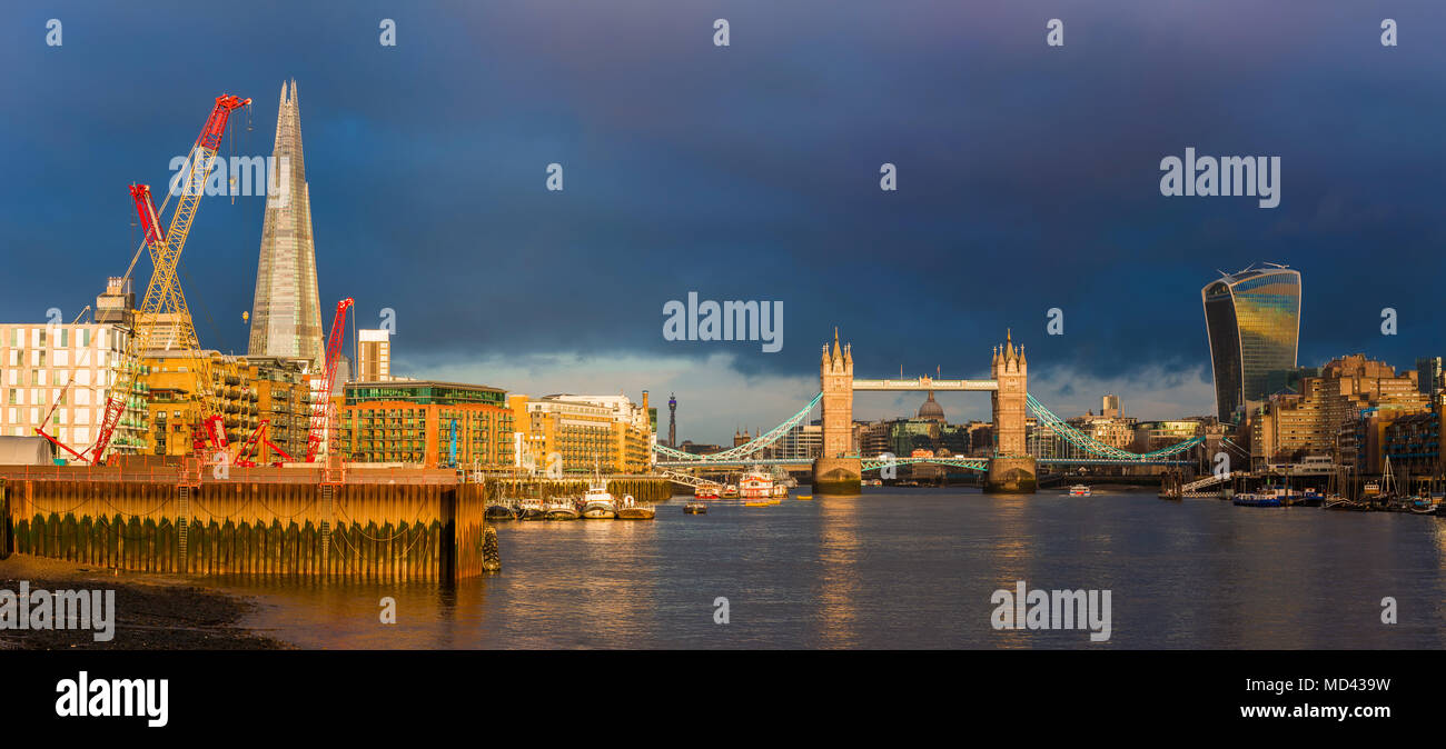 London, England - Beautiful golden sunrise in London with Tower Bridge, Shard skyscraper, St.Paul's Cathedral and other skyscrapers and landmarks. Dra Stock Photo