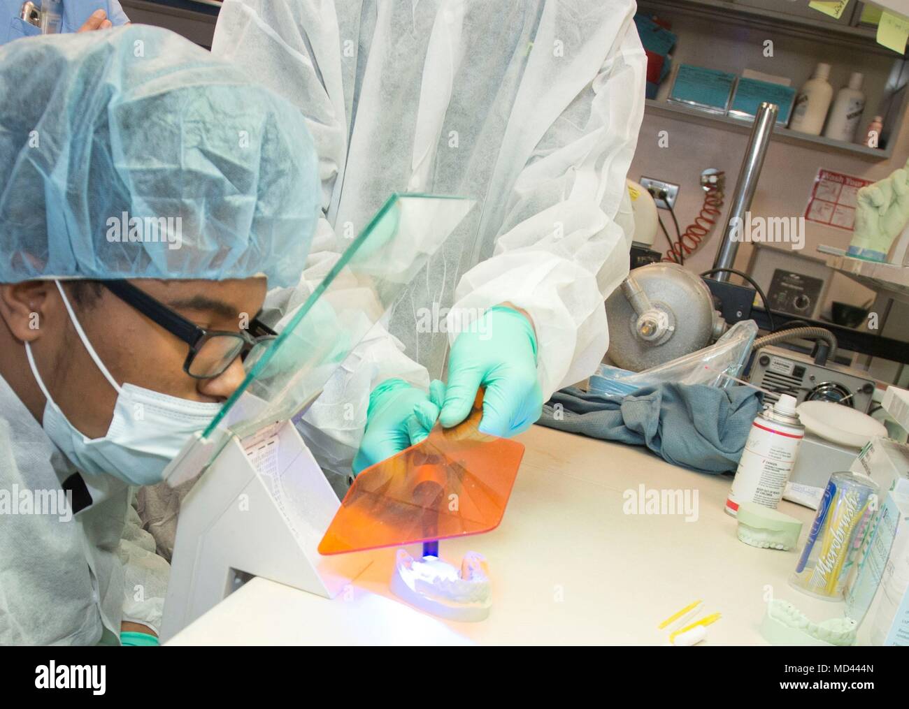 A Crosswell Home for Children resident uses a heat light to cure a