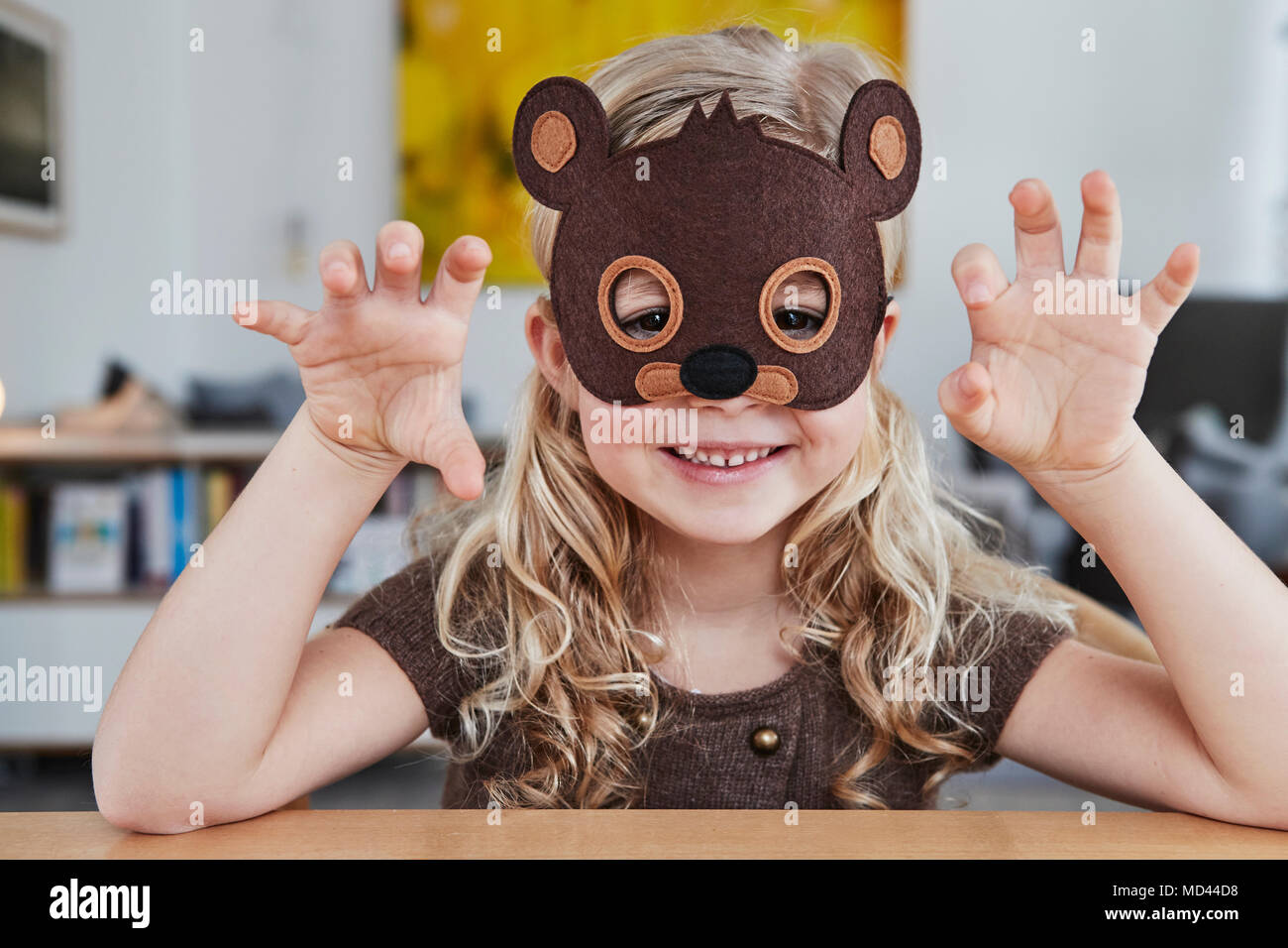 Portrait of young girl wearing bear mask Stock Photo