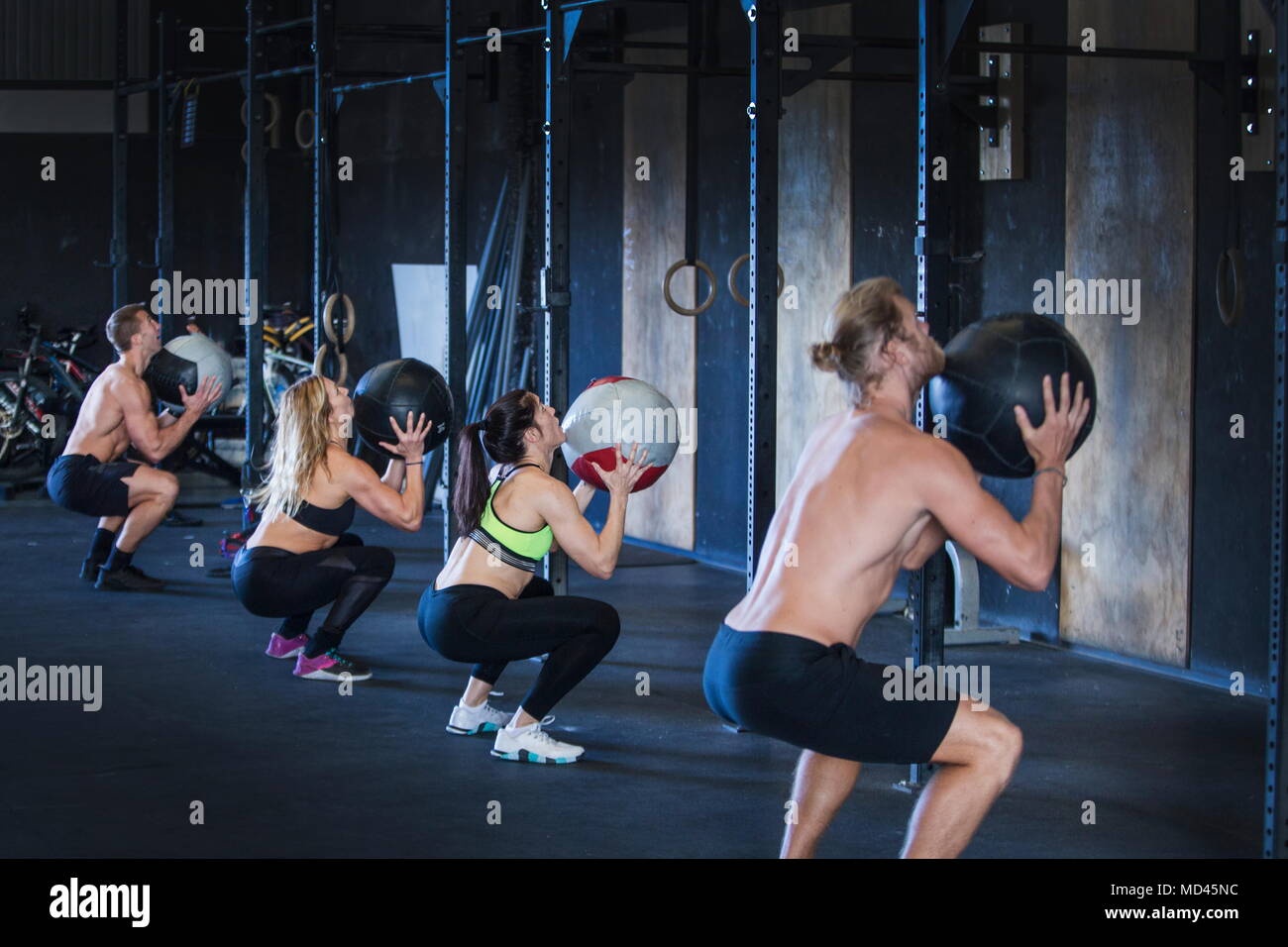Group of people exercising in gym, using medicine balls Stock Photo Alamy