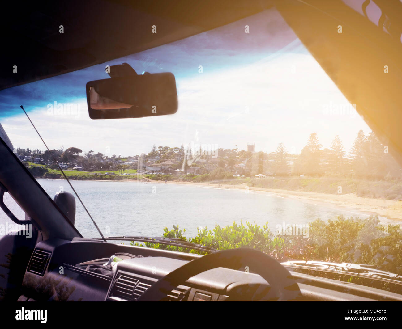 View of Bermagui, seen through windscreen of car, New South Wales, Australia Stock Photo