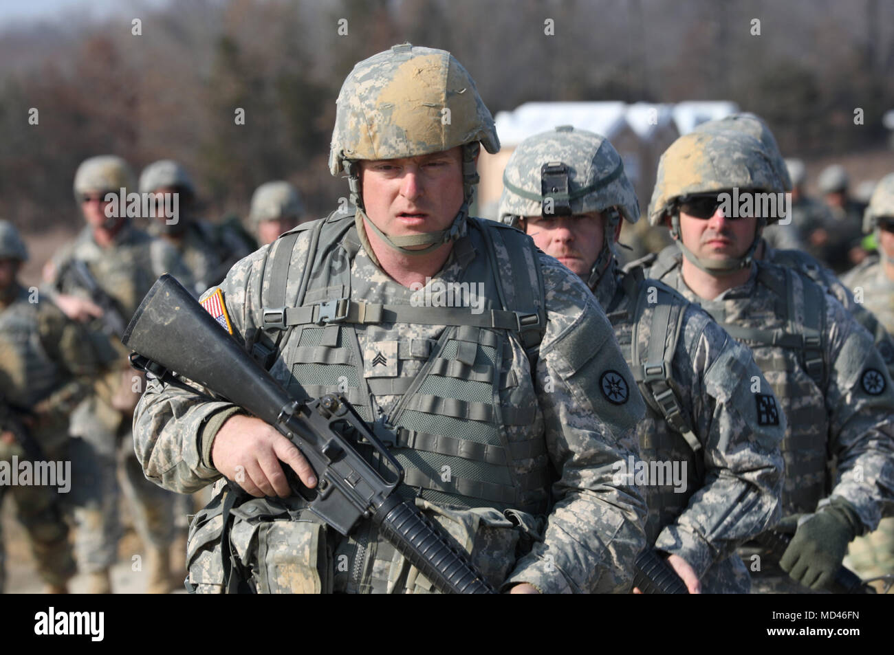U.S. Army Reserve Soldiers march during the Combat Support Training Exercise (CSTX) 78-18-03 at Fort Knox, Kentucky, March 15, 2018. CSTX 78-18-03 is a training exercise that ensures America's Army Reserve units and Soldiers are trained and ready to deploy on short-notice and bring capable, combat-ready and lethal firepower in support of the Army and our joint partners anywhere in the world.  (U.S. Army Reserve photo by Spc. Torrance Saunders) Stock Photo