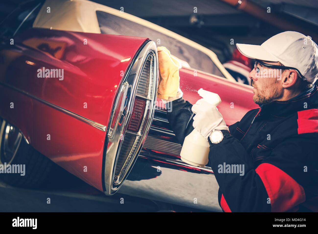 Classic Cars Detailing Cleaning Performing by Professional Body Cleaning Worker. Stock Photo