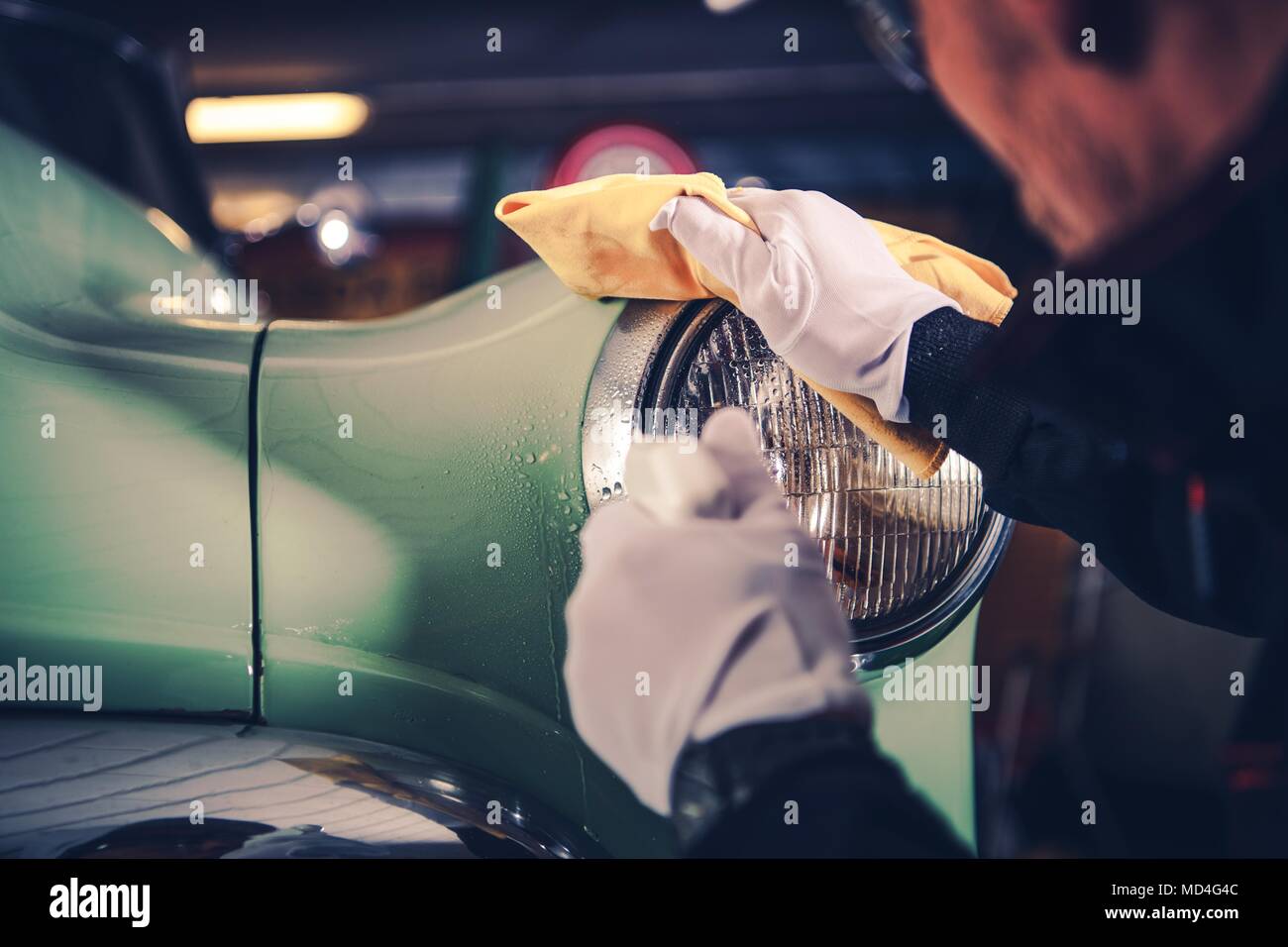 Retro Car Detailing. Classic Car Cleaning by Professional Vehicle Cleaner. Stock Photo