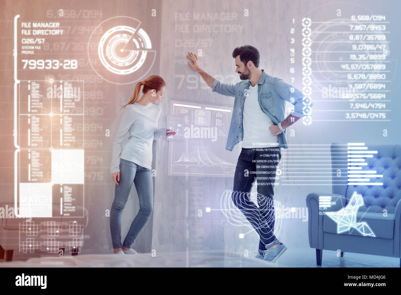 Young programmers smiling while working at the common project Stock Photo