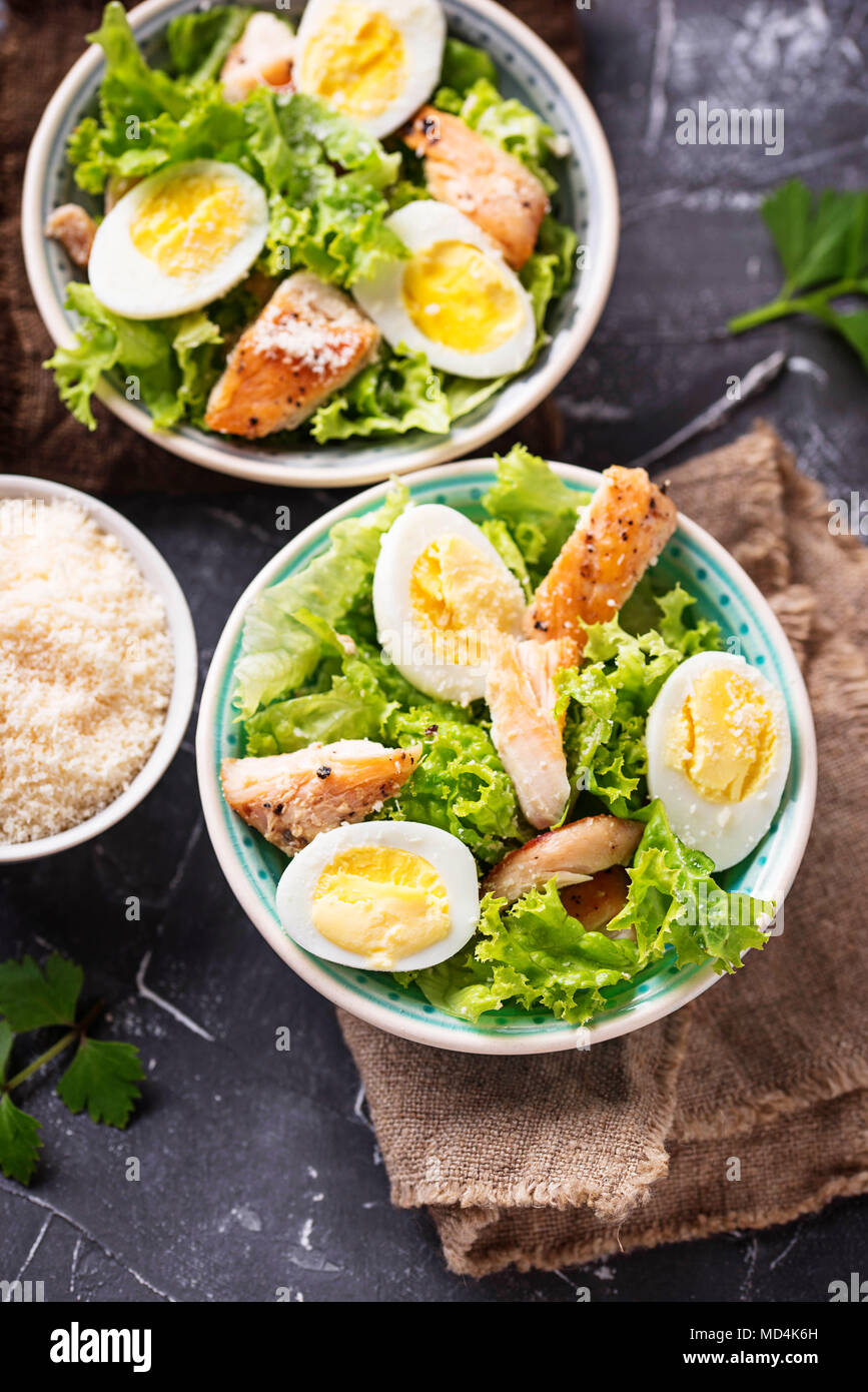 Caesar salad with eggs, chicken and parmesan Stock Photo