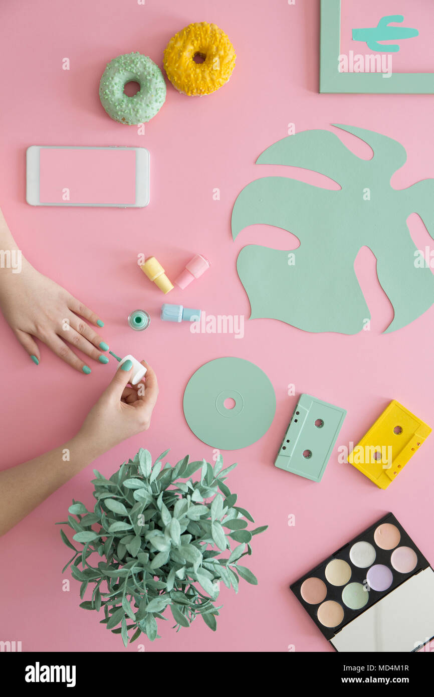 Download Woman Painting Nails On Pink Desk With Yellow Doughnut Mint Leaf And Mockup Of Smartphone Beauty Blogger Concept Stock Photo Alamy