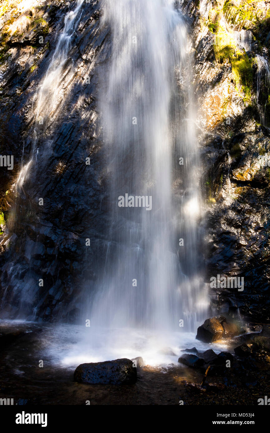 Waterfall of Queureuilh near Le Mont Dore village, Puy de Dome department, Auvergne, France Stock Photo