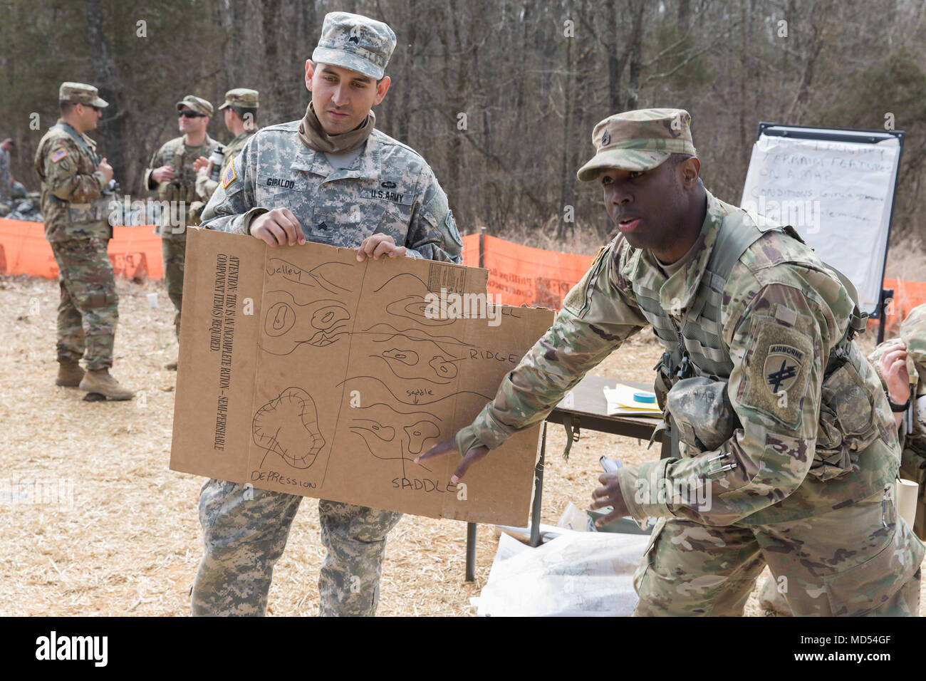 U.S. Army Reserve Staff Sgt. Levon T. Wilson, with the 437th Civil Affairs Battalion, 364th Civil Affairs Brigade, Ft. Story, Virginia, instructs a class on land navigation during the Combat Support Training Exercise (CSTX) at Fort Knox, Kentucky, March 18, 2018. CSTX 78-18-03 is a Combat Support Training Exercise that ensures America's Army Reserve units and Soldiers are trained and ready to deploy on short-notice and bring capable, combat-ready, and lethal firepower in support of the Army and our joint partners anywhere in the world. (U.S. Army photo by Spc. Jesse Coggins) Stock Photo