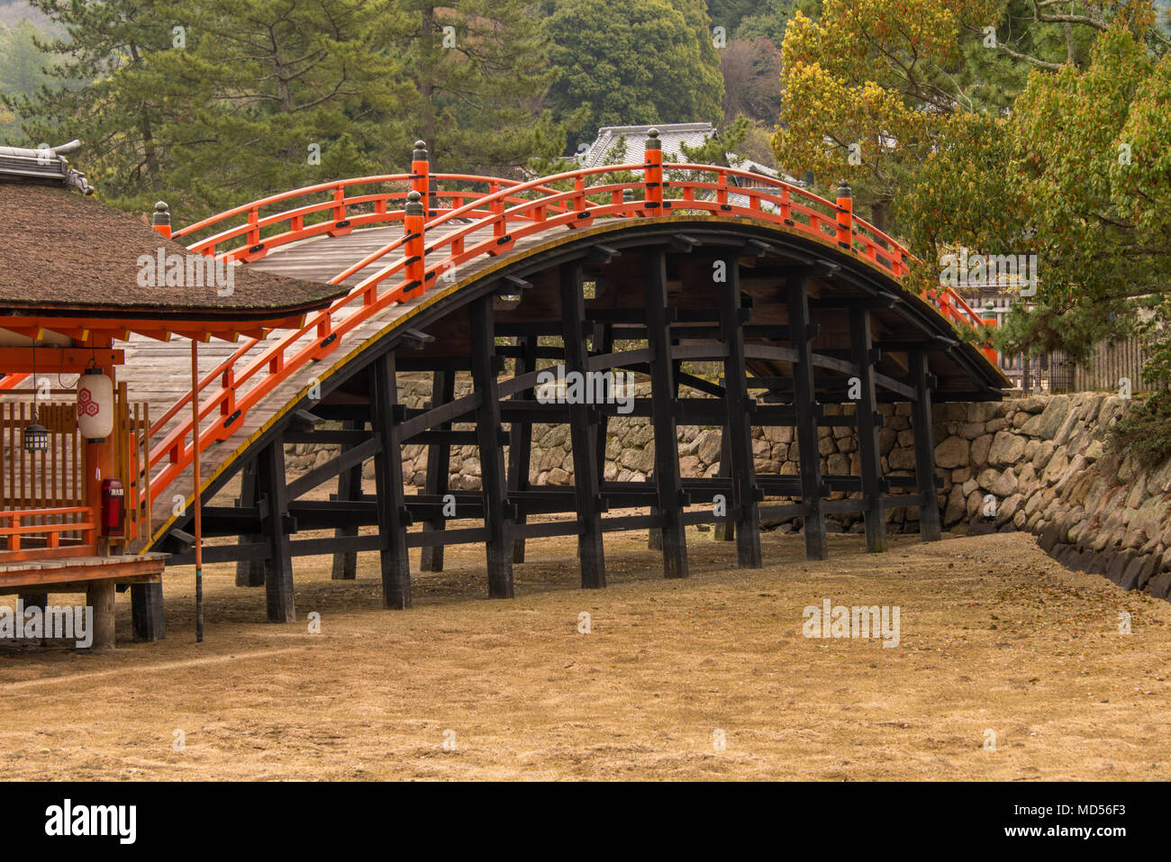Wooden bridge over mudflats at high tide, Itsukushima Shrine. Stock Photo