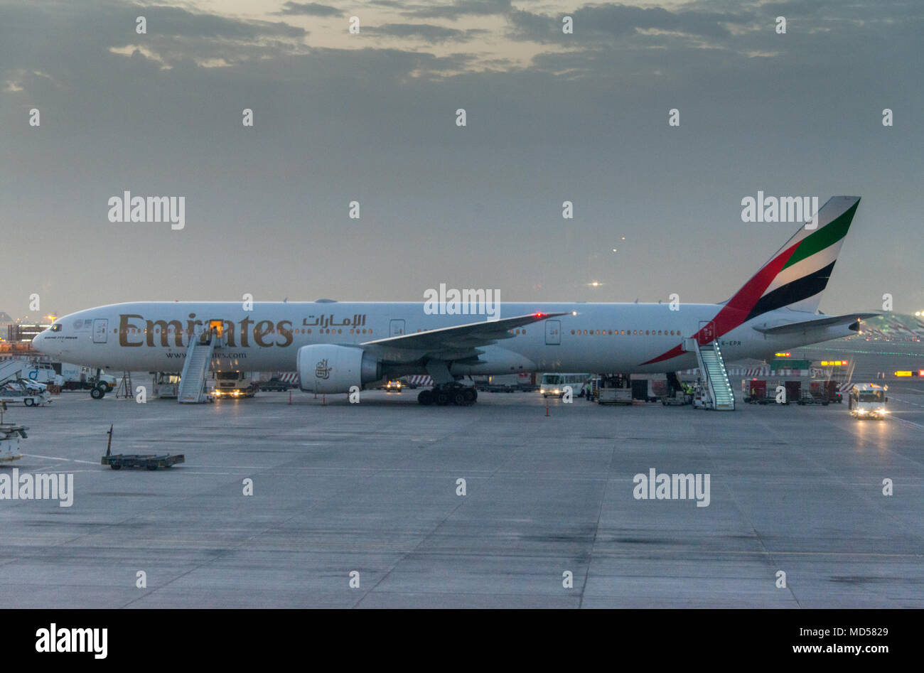 Boeing 777-300ER at Dubai Airpot (DXB) shortly after dawn. Stock Photo