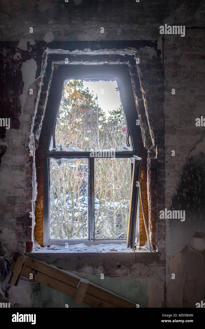 Abandoned people home (blind window). Attractiveness and awfulness of abandoned buildings (ghost town, forsaken house) for urban culture and successfu Stock Photo