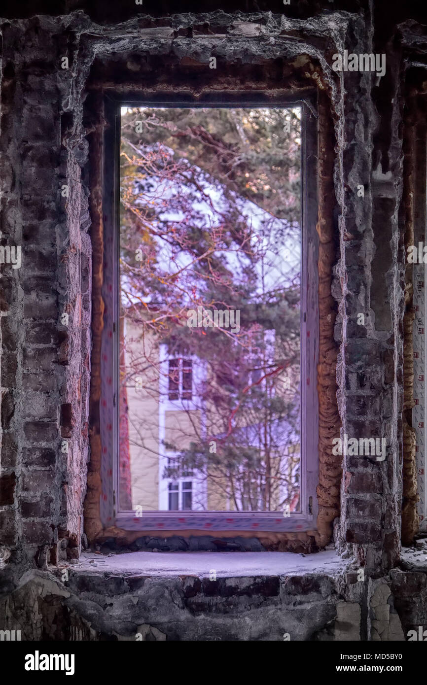 Abandoned people home (blind window). Attractiveness and awfulness of abandoned buildings (ghost town, forsaken house) for urban culture and successfu Stock Photo