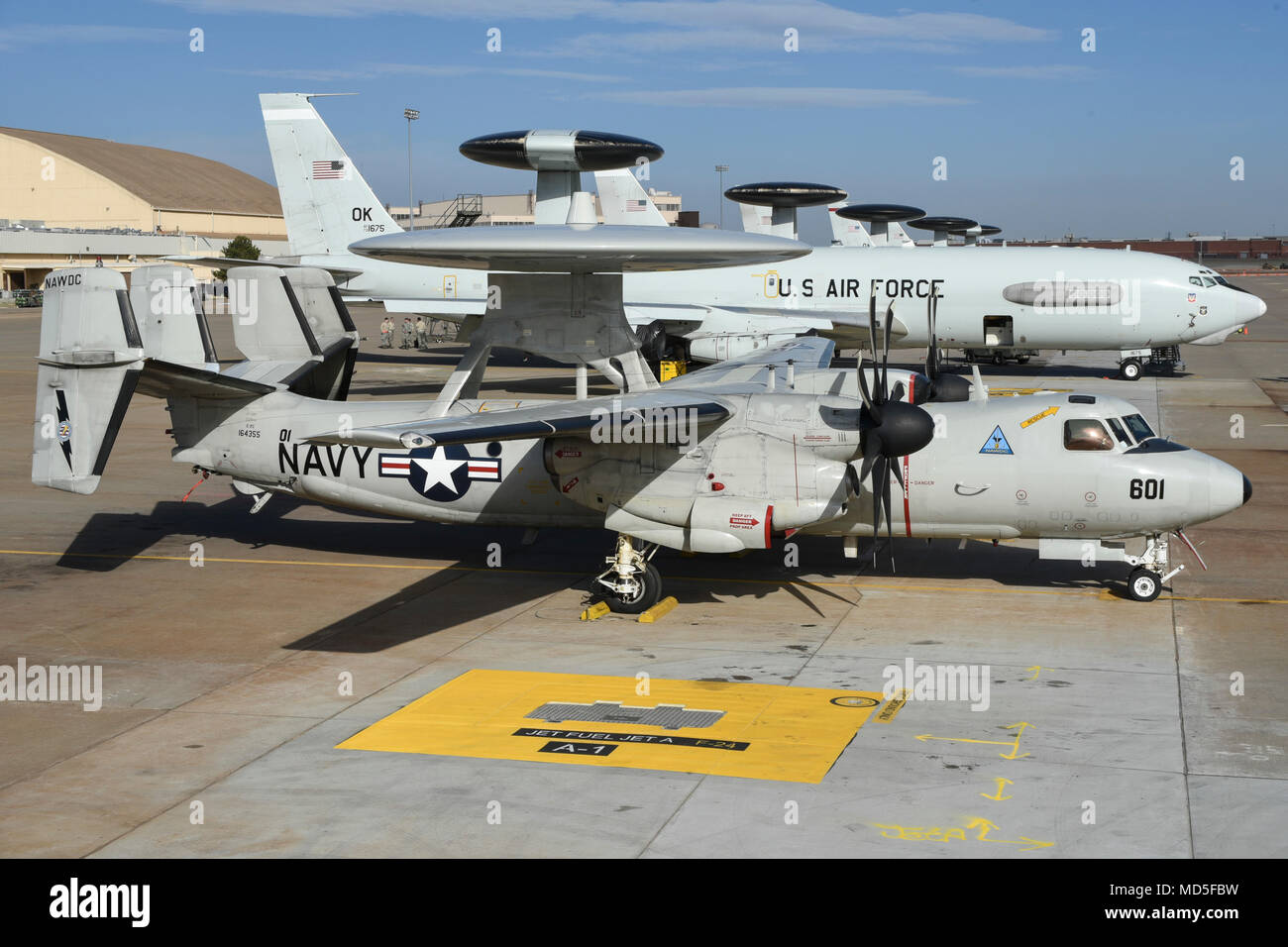 A Navy E 2c Hawkeye Airborne Early Warning Aircraft From Naval Aviation Warfighting Development Center Naval Air Station Fallon Nevada Shown On The Flight Line Next To Air Force E 3 Airborne Warning And