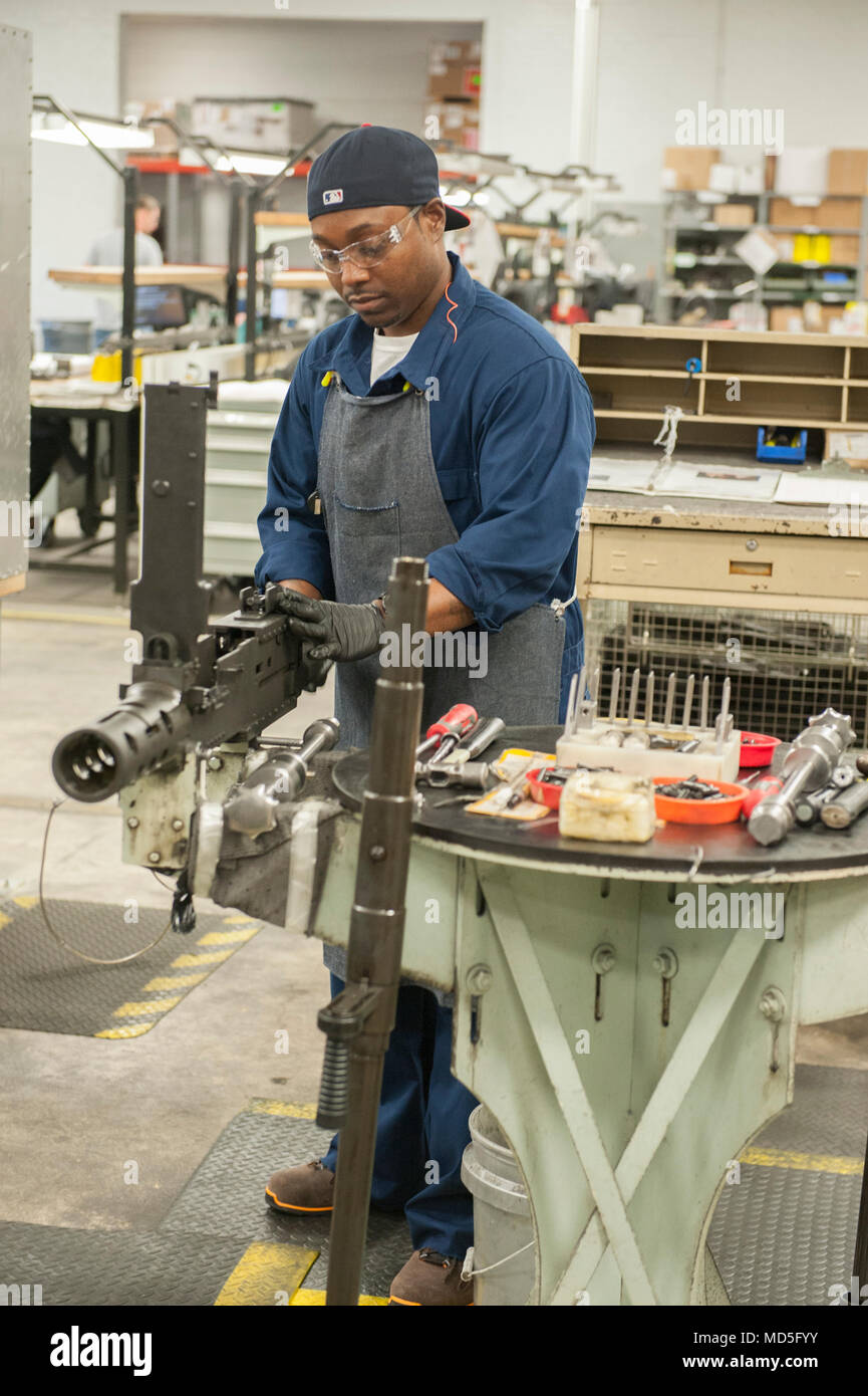 Jujuan Jones performs final gauging checks to set headspace and timing