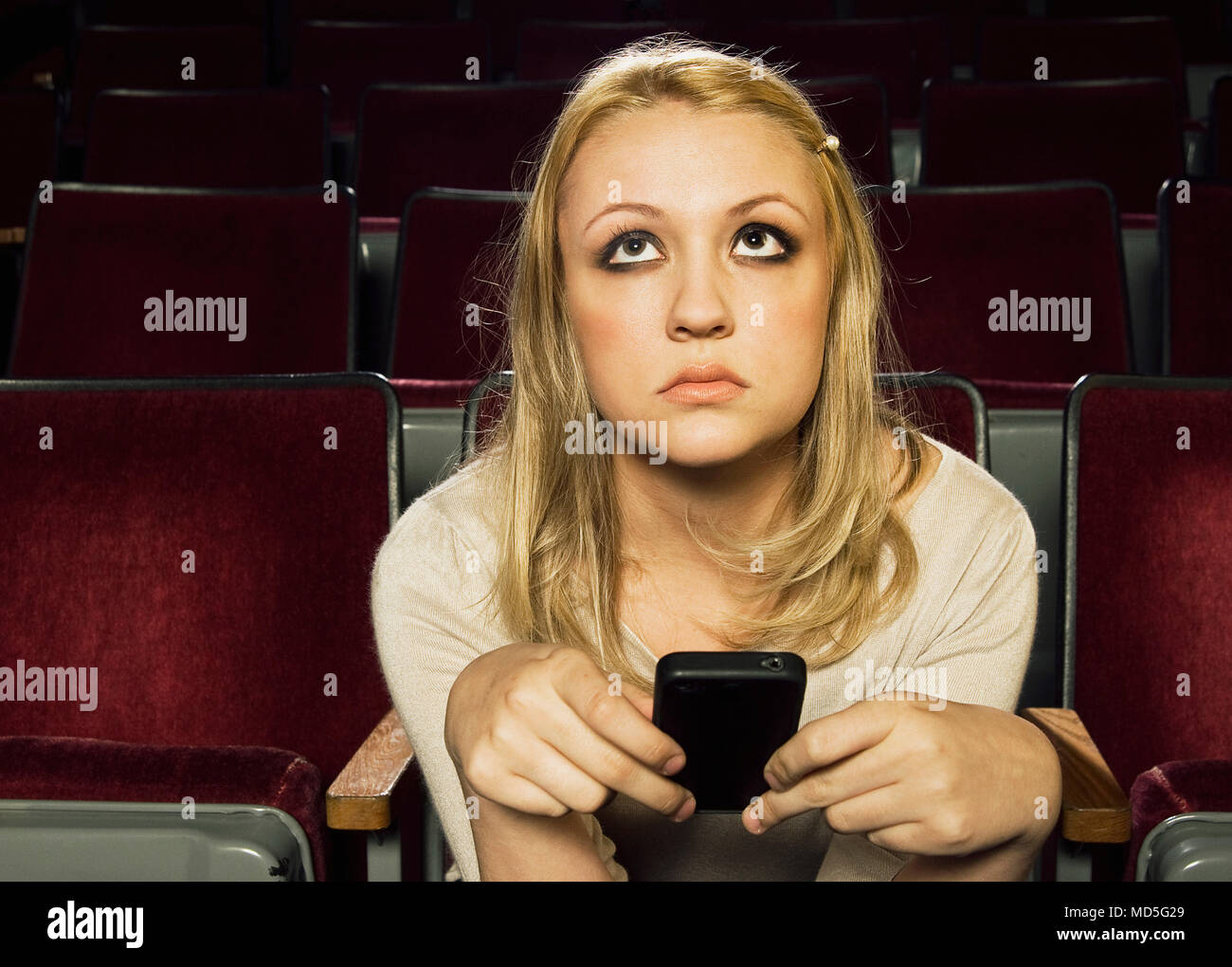 Woman theater cell phone hires stock photography and images Alamy