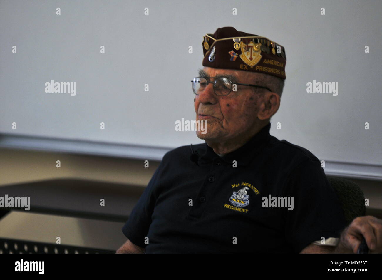 Paul Kerchum, a Chief Master Sgt. (Ret.) with the Air Force and the Army Air Corps, describes his experiences in World War II and his involvement in the Bataan Death March to a crowd of visitors at White Sands Missile Range, New Mexico, March 24, 2018.  Thousands of prisoners of war died in the Bataan Death March, a forced relocation of prisoners in April 1942 through inhospitable jungle, who were denied proper food, water and medical attention.  (U.S. Army photo by Pvt. Matthew J. Marcellus) Stock Photo