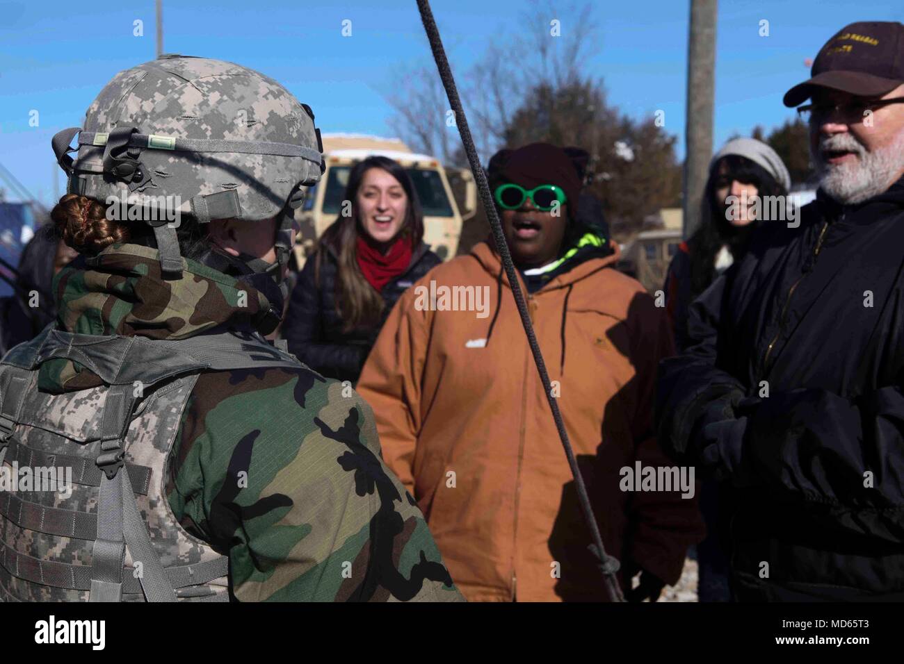 U.S. Army Reserve 1st Sgt. Lauren Herrick, of the 364th Civil Affairs Brigade, speaks with civilians acting as local nationals as a part of a civil affairs training exercise during the Combat Support Training Exercise (CSTX) at Fort Knox, Kentucky, March 22, 2018. CSTX 2018 ensures Army reserve units are trained and ready to deploy on short notice and bring capable, combat ready, and lethal firepower in support of the Army and our joint partners anywhere in the world. (U.S. Army photo by Spc. Durrell Jones) Stock Photo