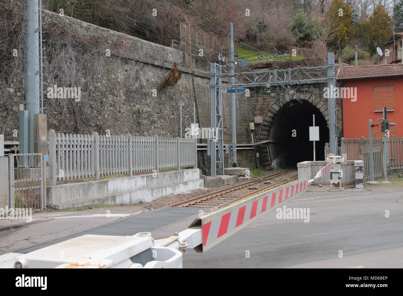 Railway crossing with barrier and tunnel. Riola, Bologna, Emilia