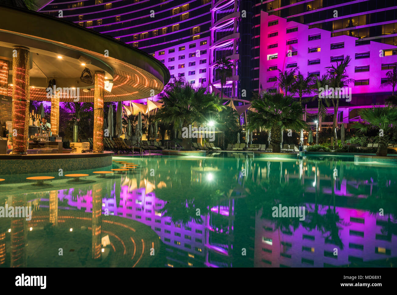 The pool and bar at the Jumeirah Beach Hotel at night in Dubai, UAE
