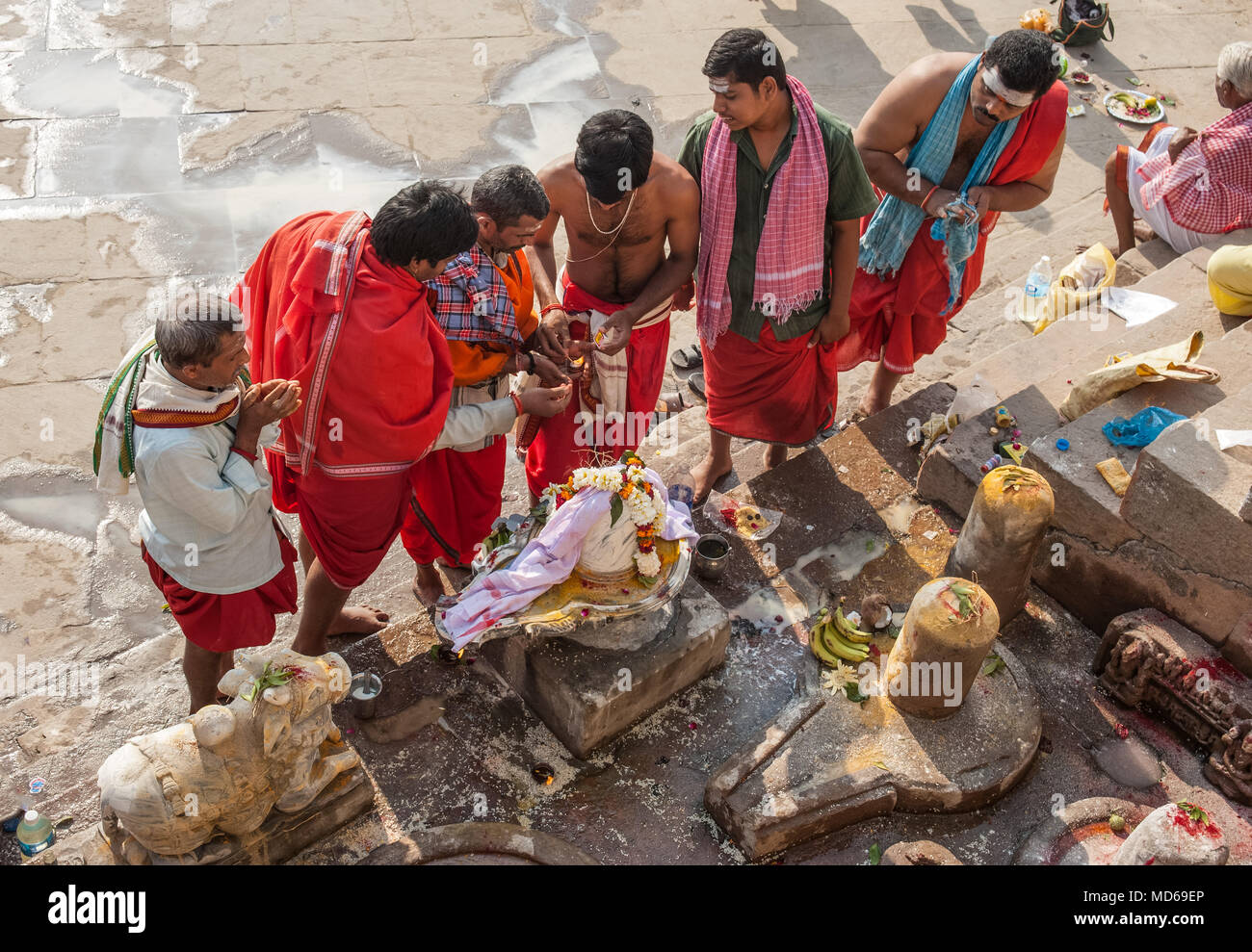 Men give puja to a decorated Shiva lingum on Maha Shivaratri in Varanasi Stock Photo