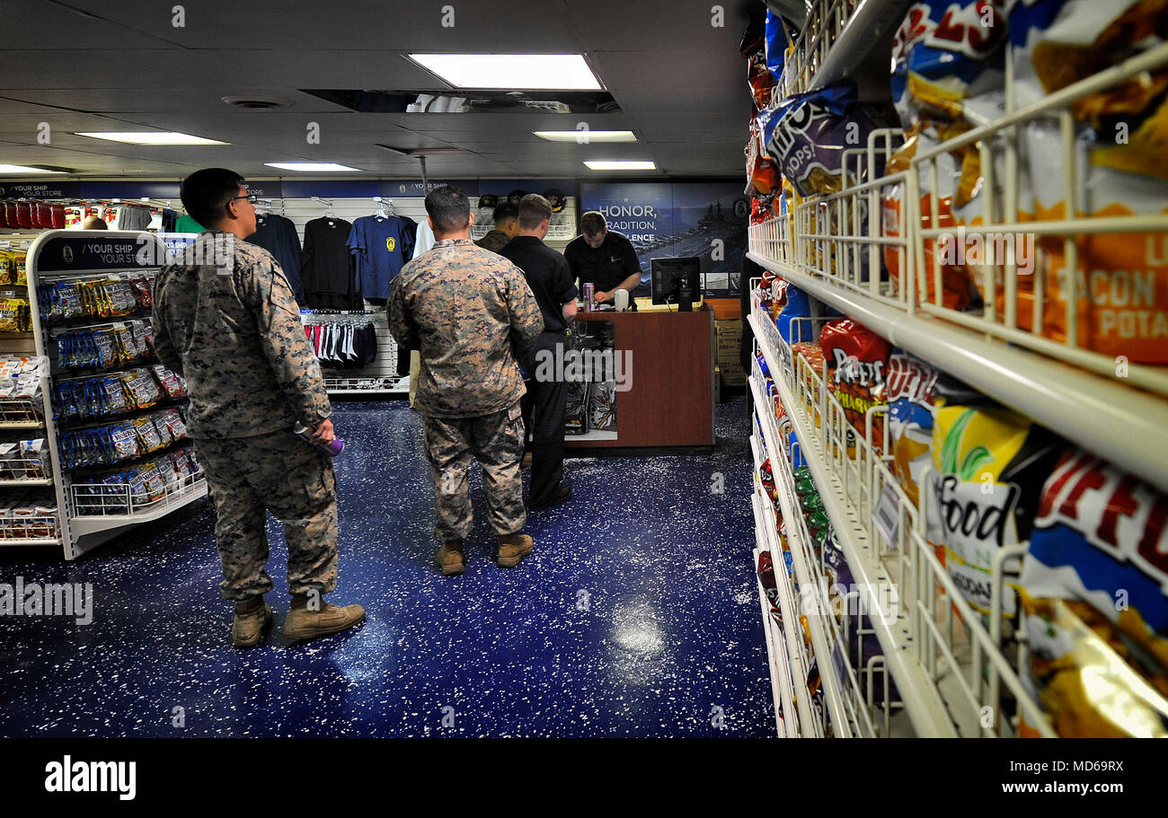 180327-N-RI884-0030 PHILIPPINE SEA (March 27, 2018) Marines with the 31st Marine Expeditionary Unit (31st MEU) shop in the ship's store aboard the amphibious assault ship USS Wasp (LHD 1). Wasp, part of the Wasp Expeditionary Strike Group, with embarked 31st Marine Expeditionary Unit, is operating in the Indo-Pacific region to enhance interoperability with partners, serve as a ready-response force for any type of contingency and advance the Up-Gunned ESG Concept. (U.S. Navy photo by Mass Communication Specialist 1st Class Daniel Barker/Released) Stock Photo