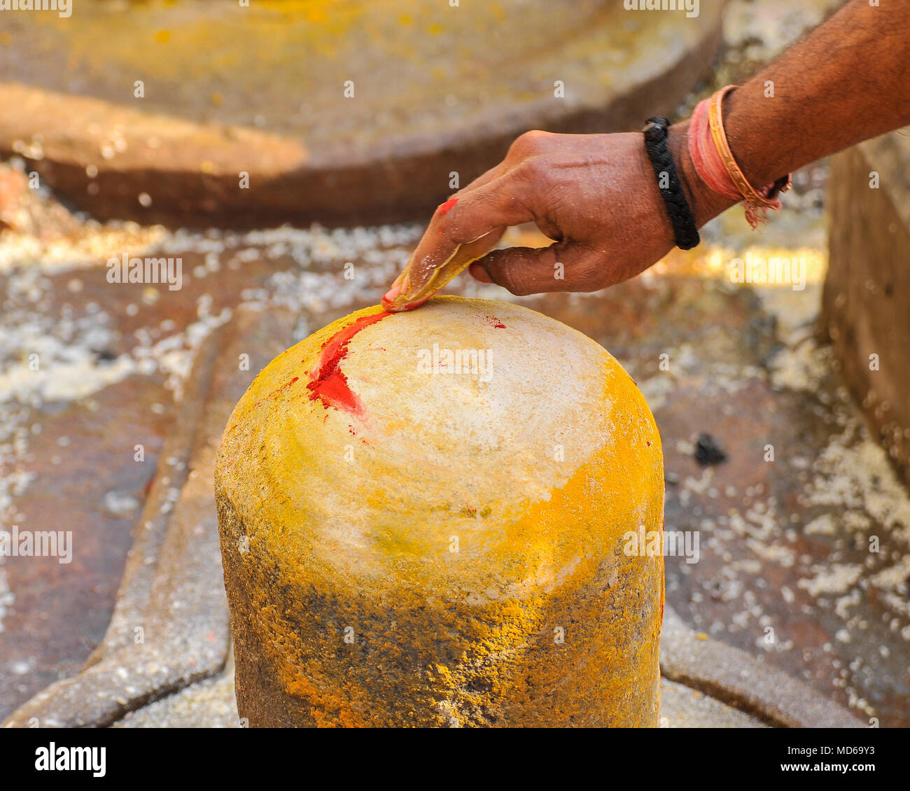 A man's hand decorates a Shiva lingum on Maha Shivaratri (1/3) Stock Photo
