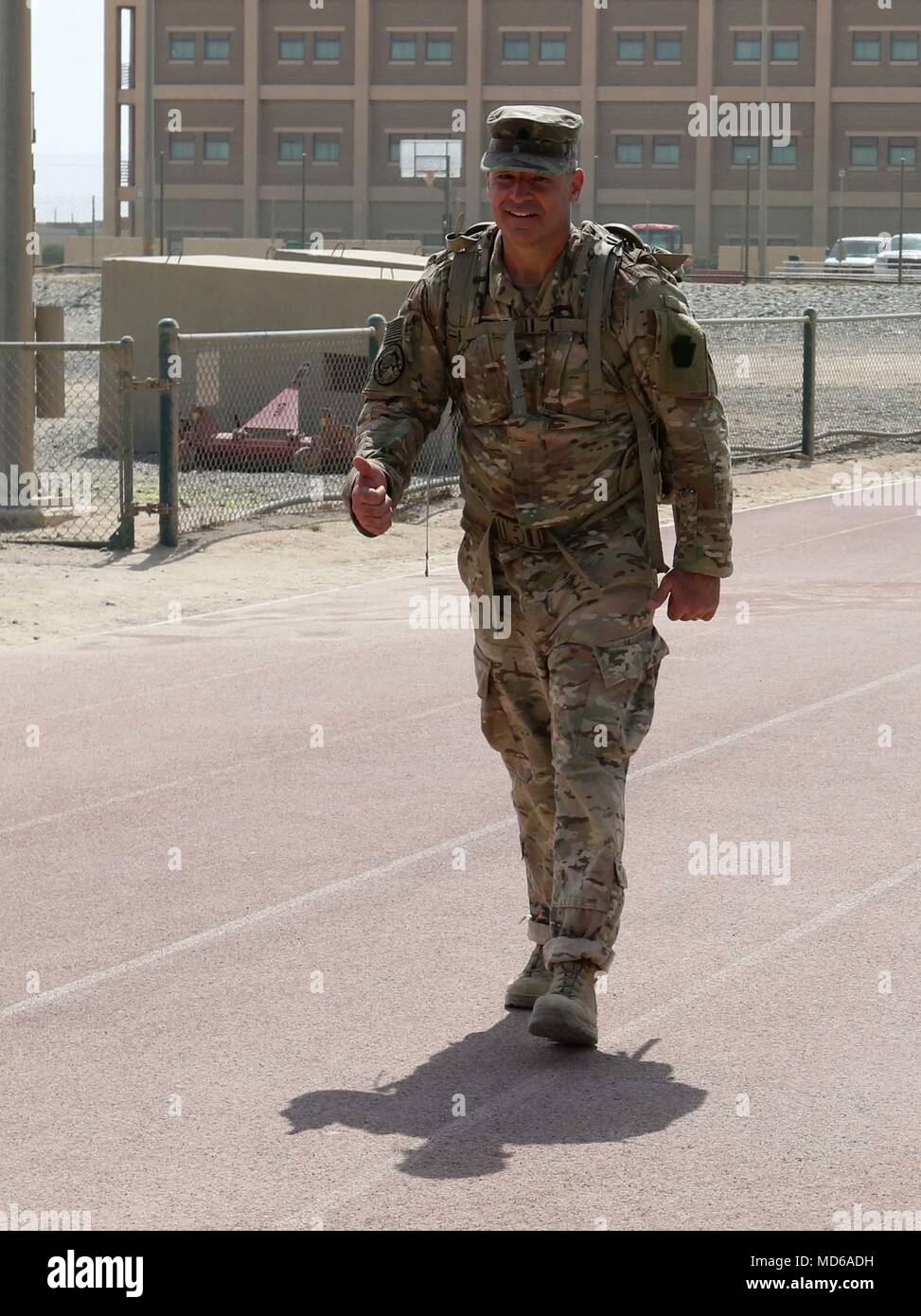 CAMP ARIFJAN, Kuwait – Lt. Col. Edward Gatewood, director of personnel recovery for the 28th Infantry Division, Task Force Spartan, and a Levittown, Pa. native, proudly strides across the finish line of the Bataan Death March on March 25, 2018. “I think this a great way to pay tribute to the service members and civilians who had to go through this – who had to do this involuntarily,” he said. Gatewood was joined by other soldiers from the 28 ID and service members from across the base to honor those lost in World War II. (U.S. Army Photo by Staff Sgt. Matthew Keeler) Stock Photo