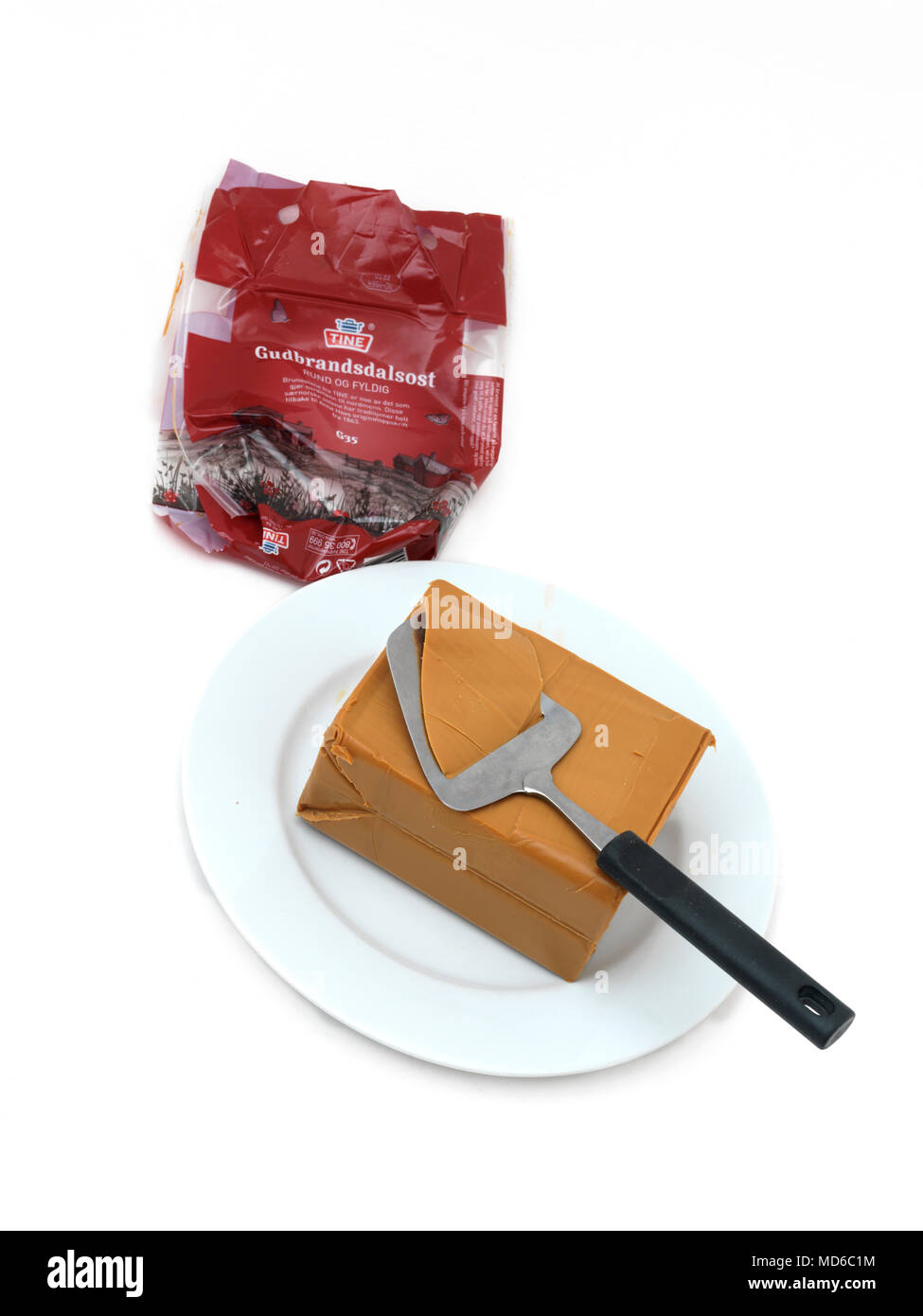 Norwegian Cheese Gjetost Gudbrandsdalsost Brown Goats Cheese On Cheese Board With Slicer Stock Photo