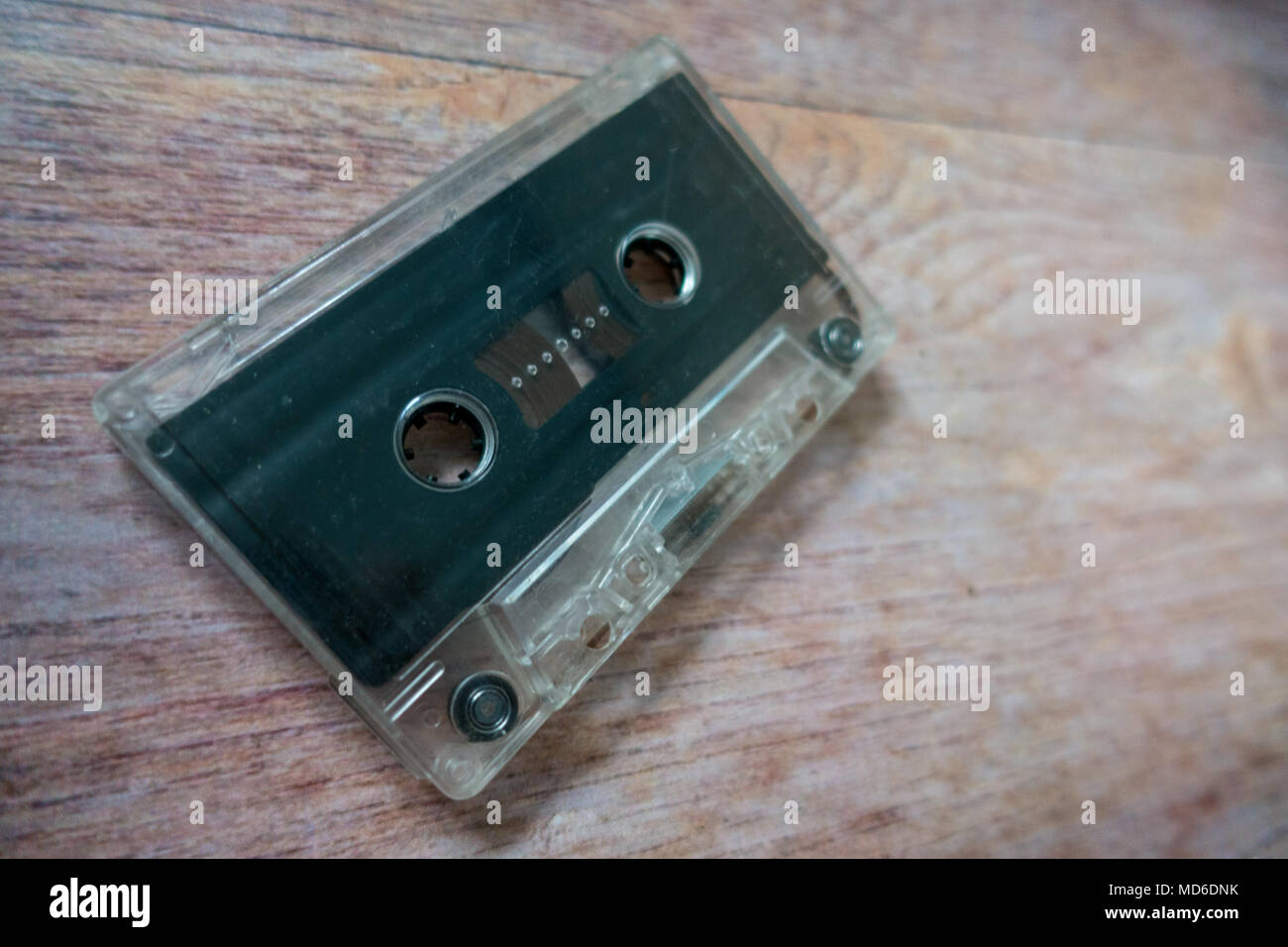 Old cassette tapes with a wooden brown background Stock Photo - Alamy